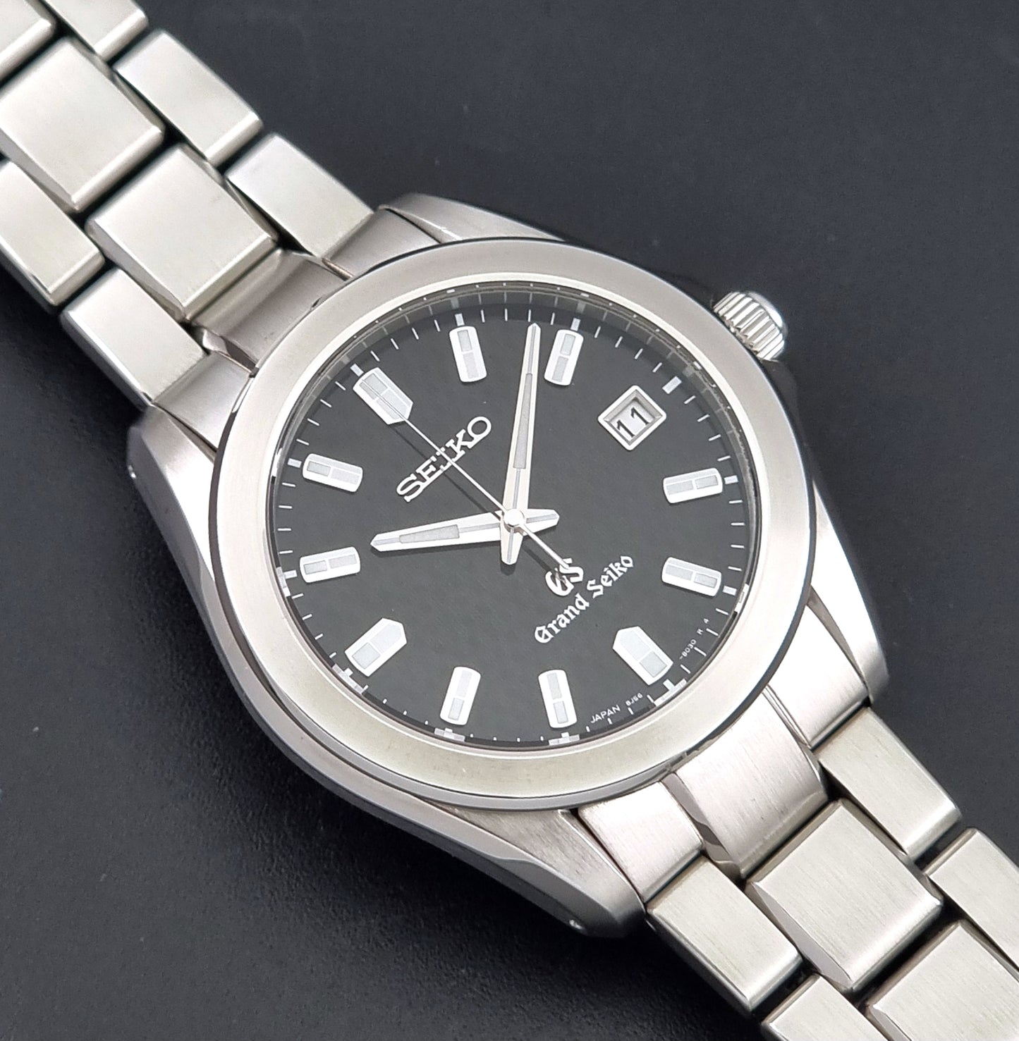 Grand Seiko SBGF021 quartz watch 8J56-8020 a close up of the watch sat on a dark background