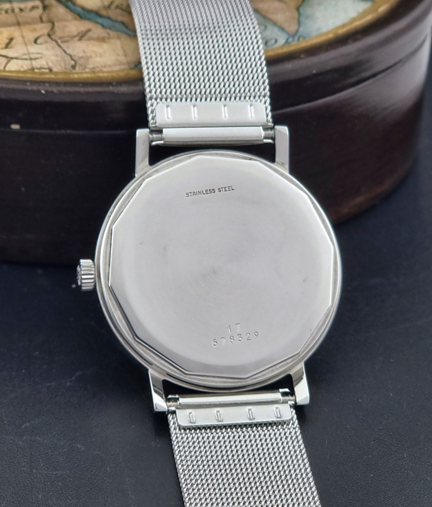 Vintage Longines Wristwatch 3029 with mesh strap on a dark surface case back view