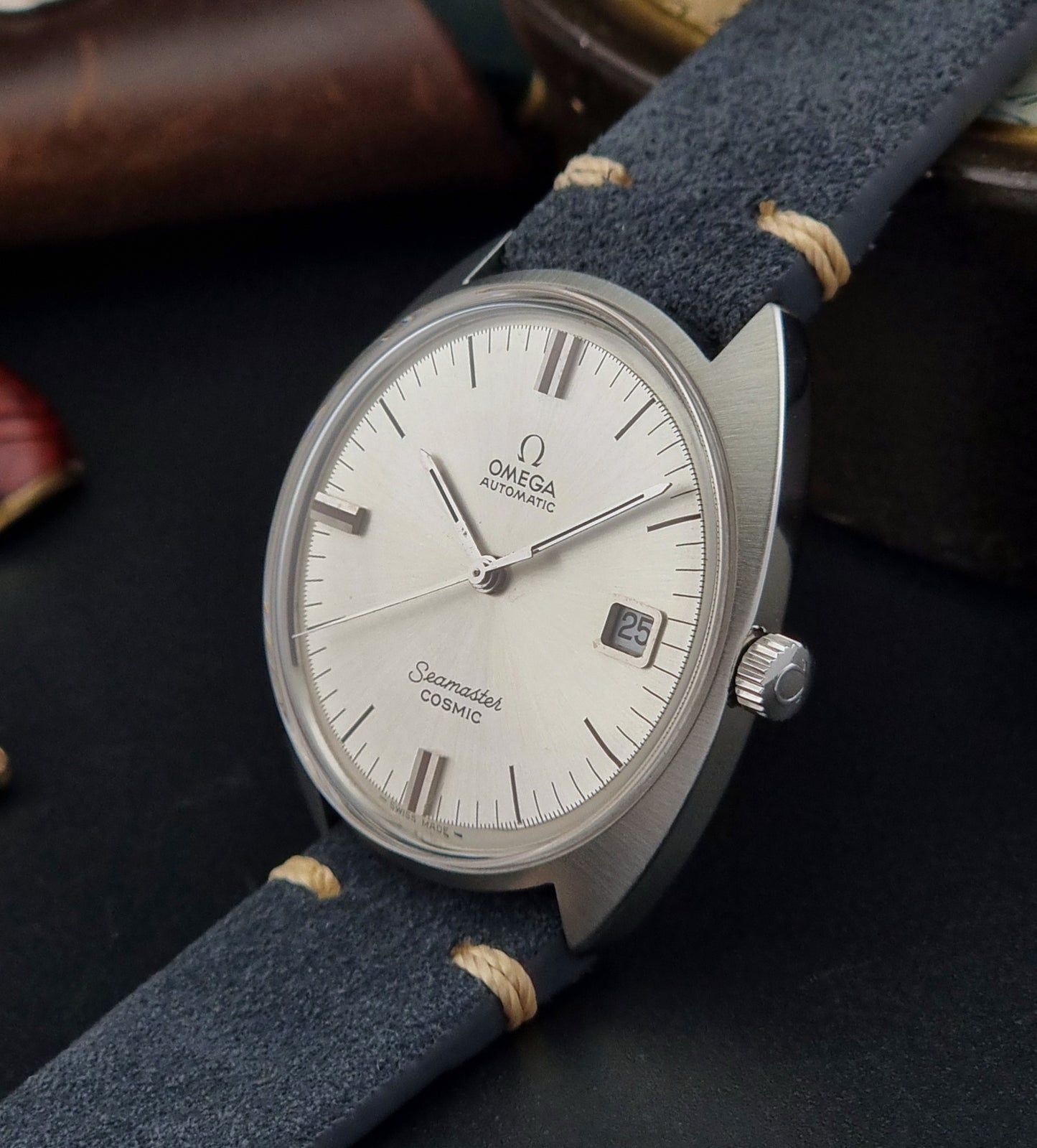 Vintage Omega Seamaster watch side view on a dark background