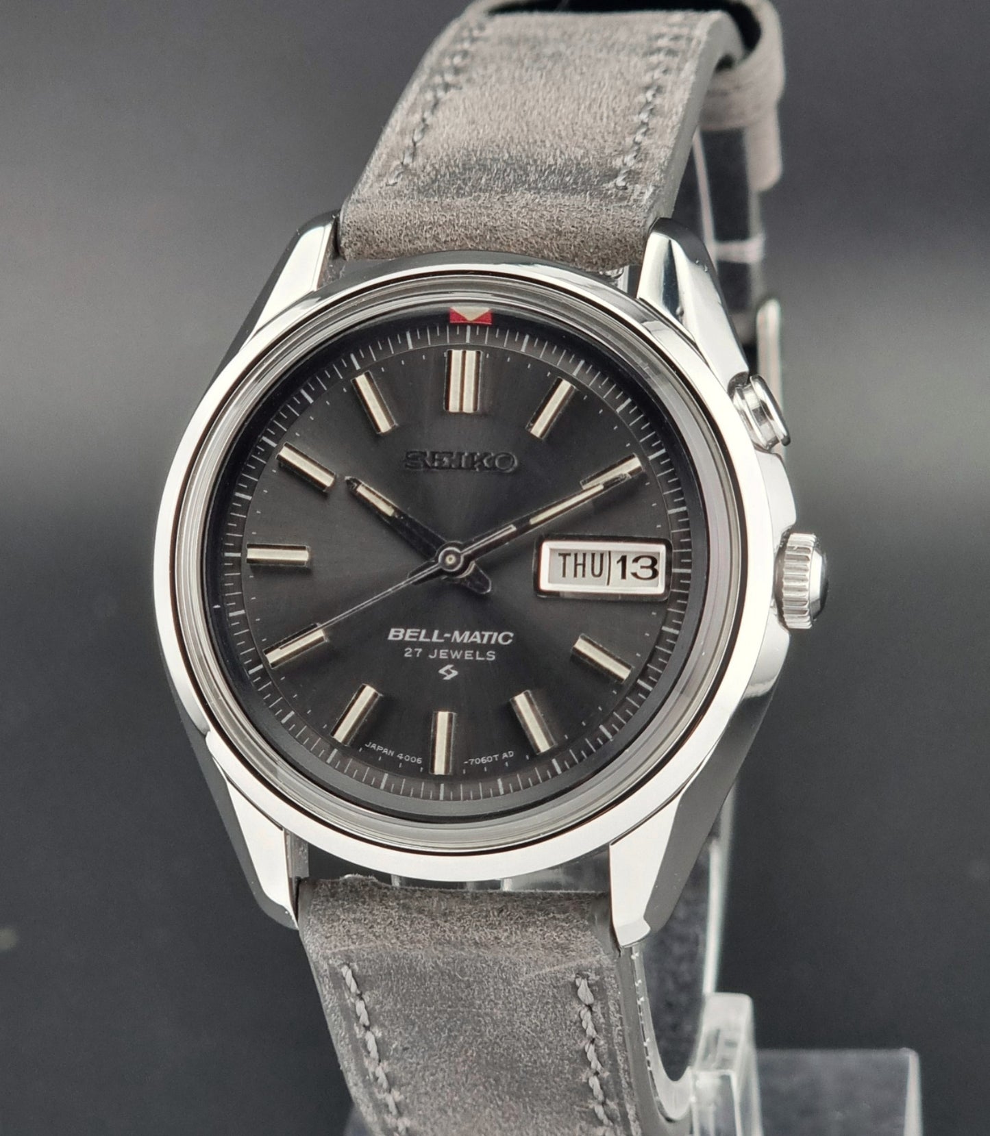 Seiko Bell-Matic watch with gray leather strap on a dark surface
