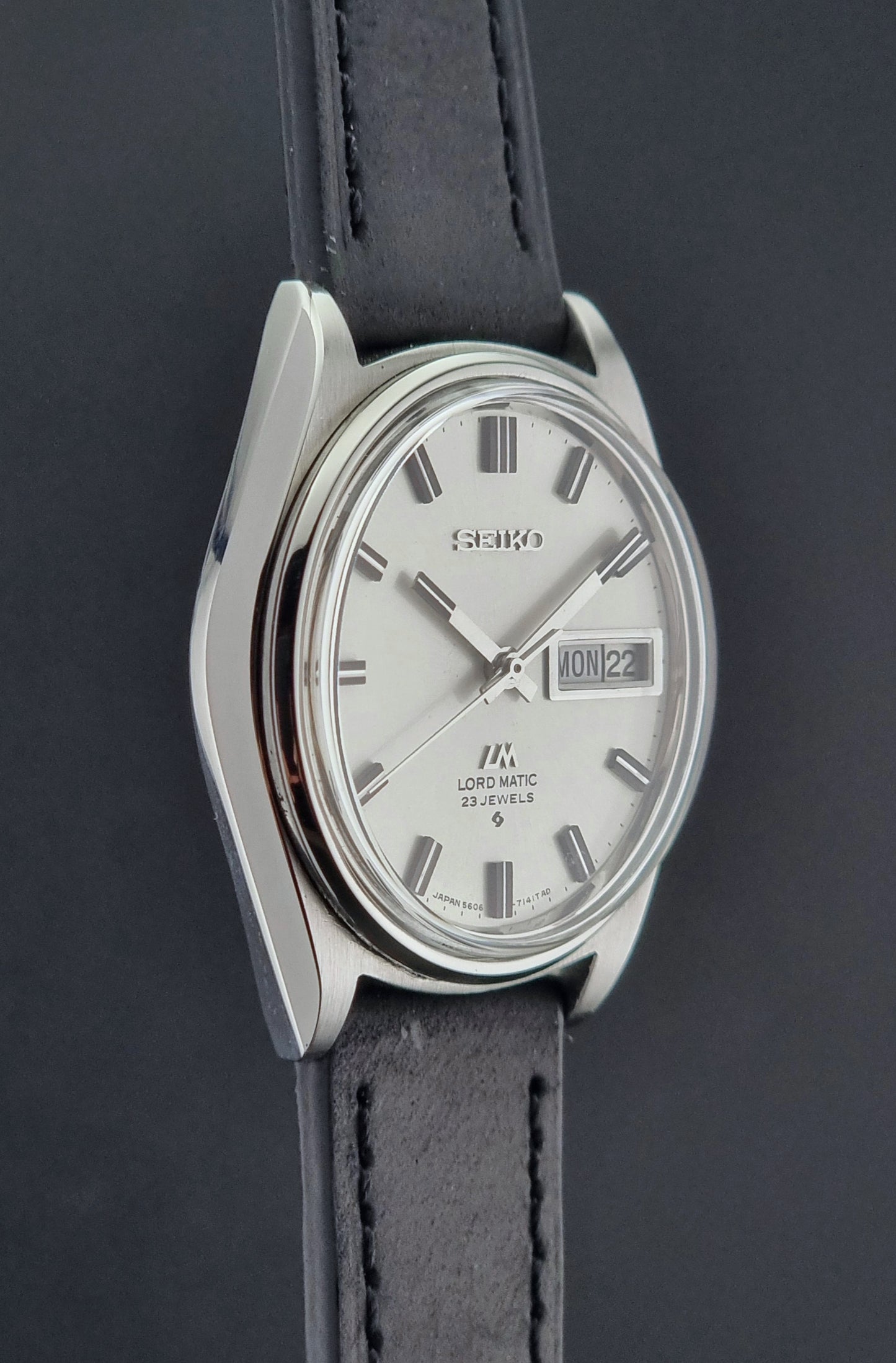Vintage Seiko Lord Matic watch with black leather strap on a dark background