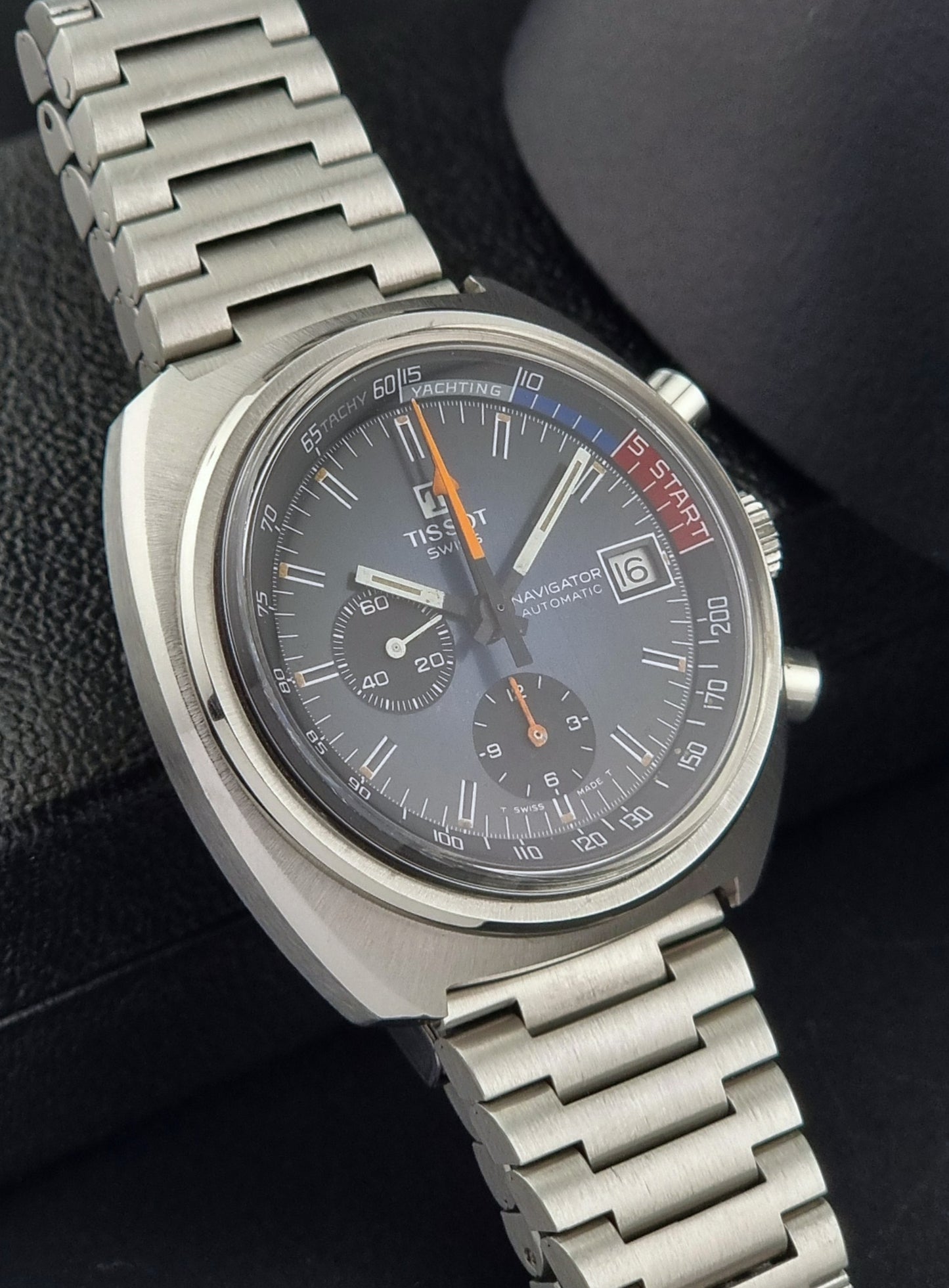 Vintage Tissot wristwatch with a detailed face on a dark background