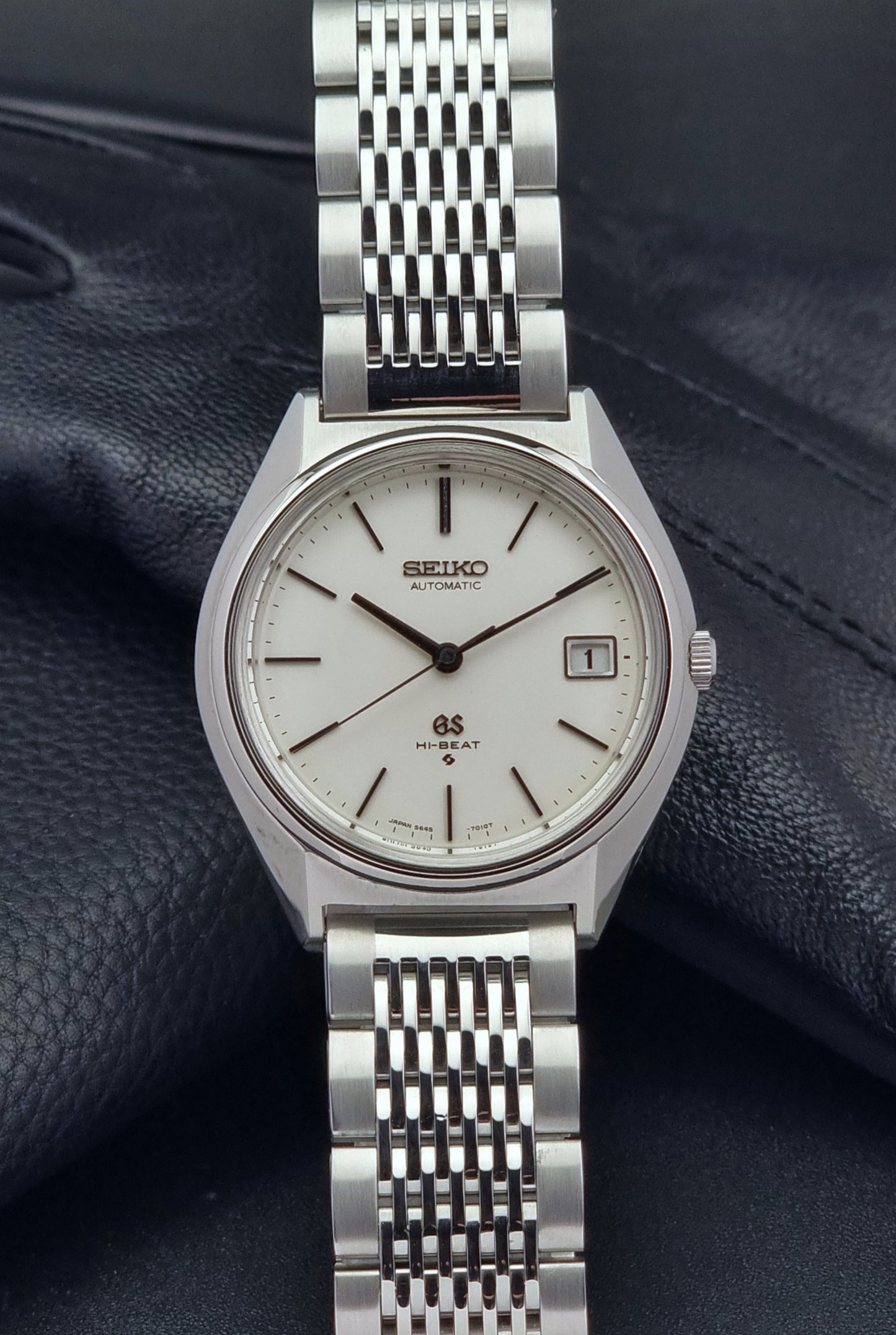 Vintage Grand Seiko Wristwatch 5646-7010 on a dark textured background