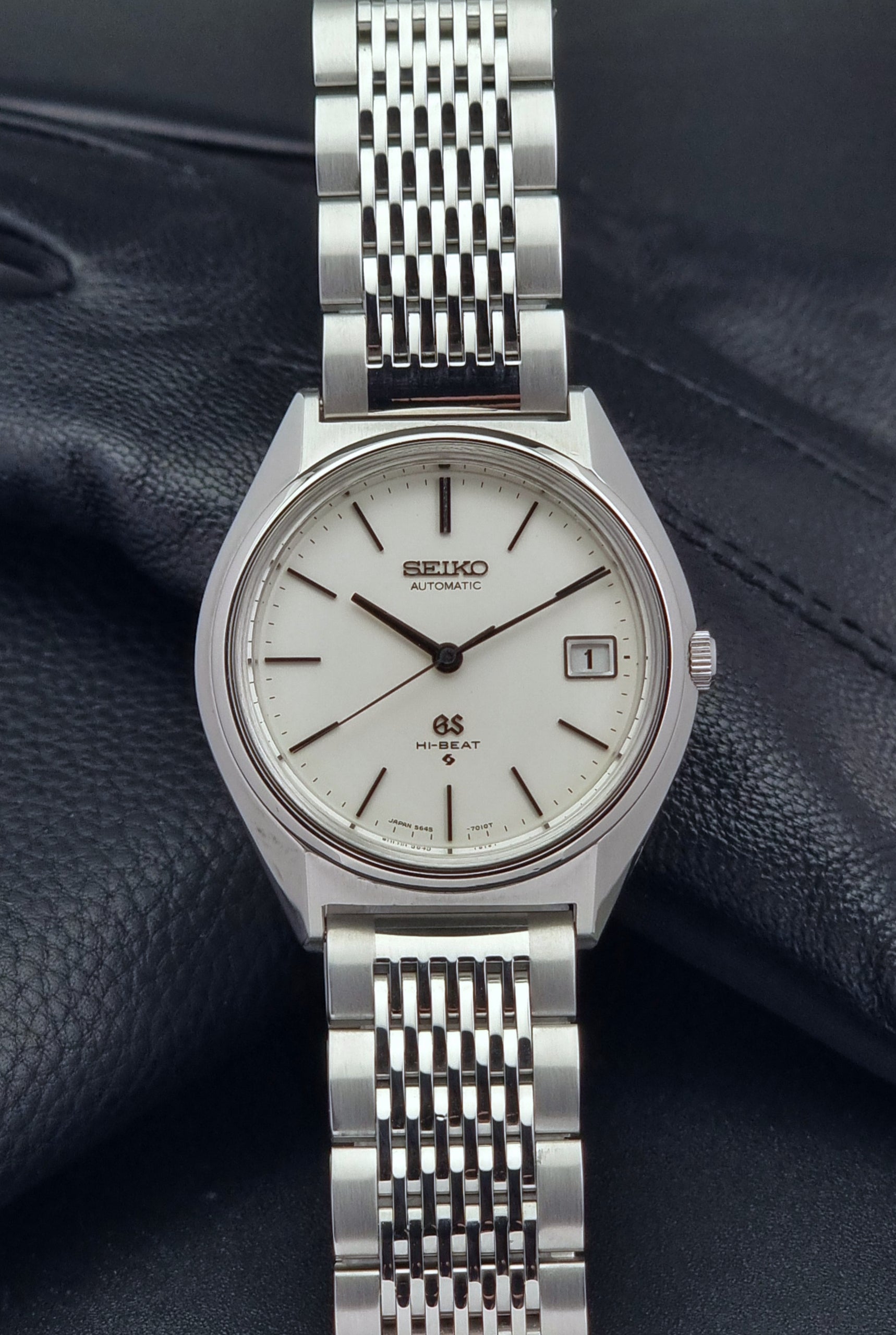Vintage Grand Seiko Wristwatch 5646-7010 on a dark textured background