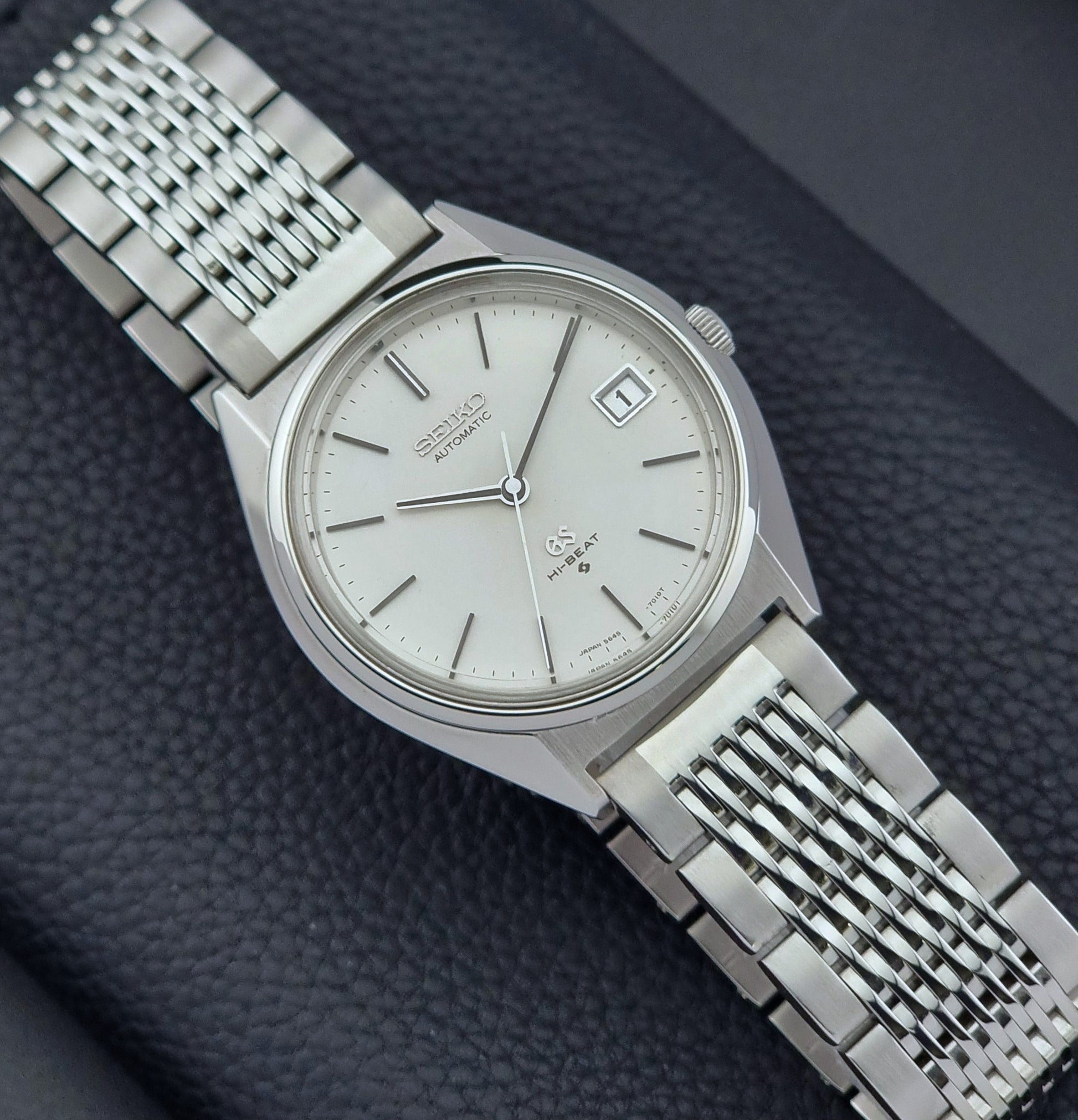 Vintage Grand Seiko Wristwatch 5646-7010 on a textured dark background