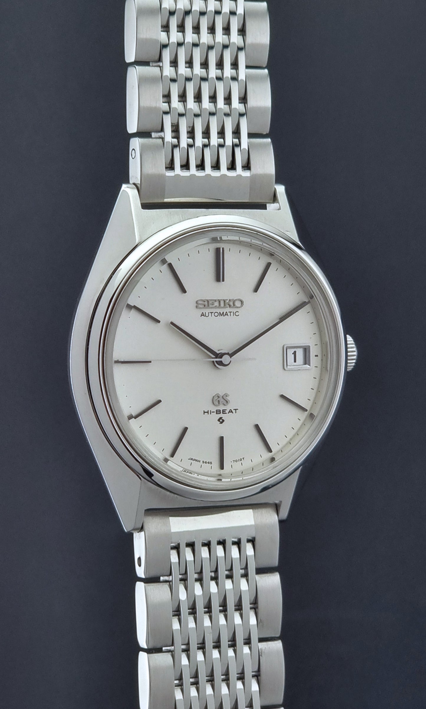 Vintage Grand Seiko Wristwatch 5646-7010 with a dark background side profile
