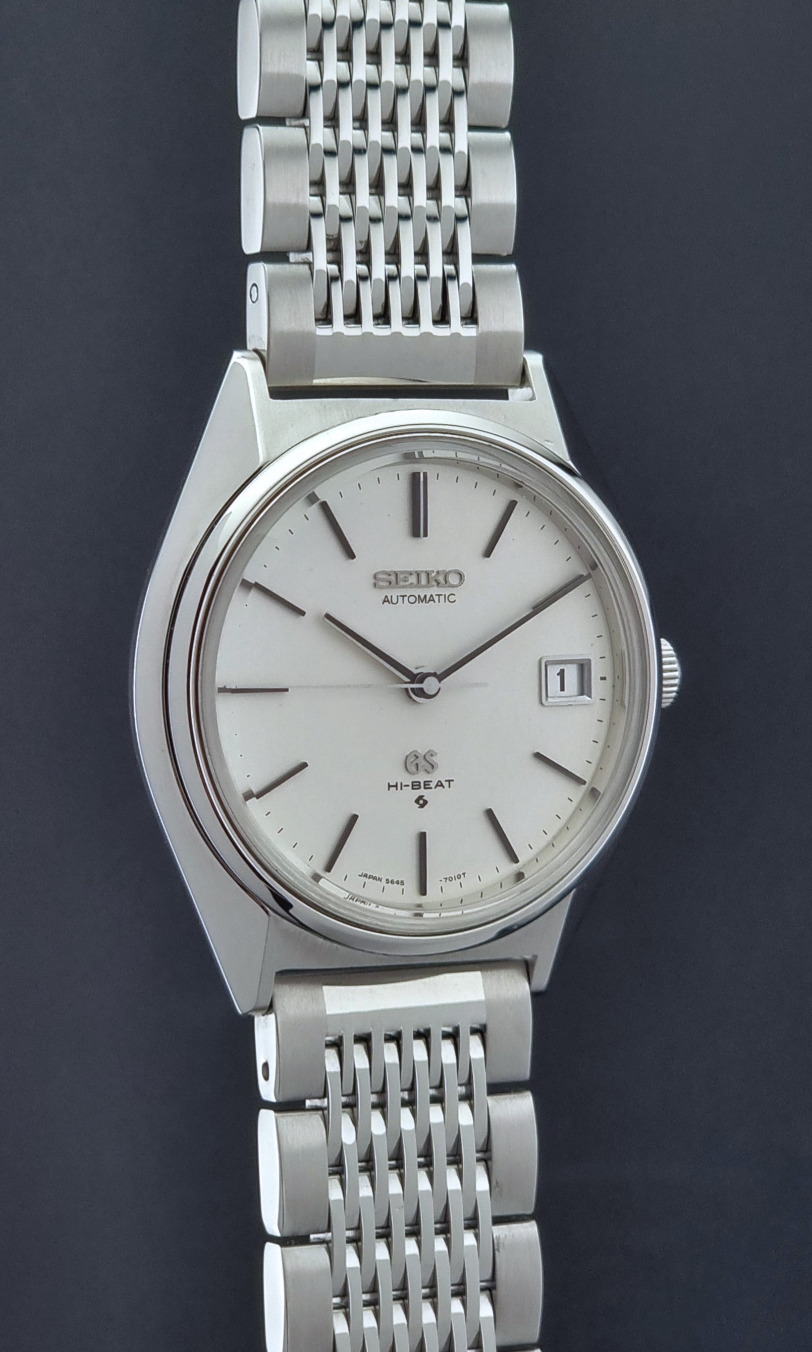 Vintage Grand Seiko Wristwatch 5646-7010 with a dark background side profile