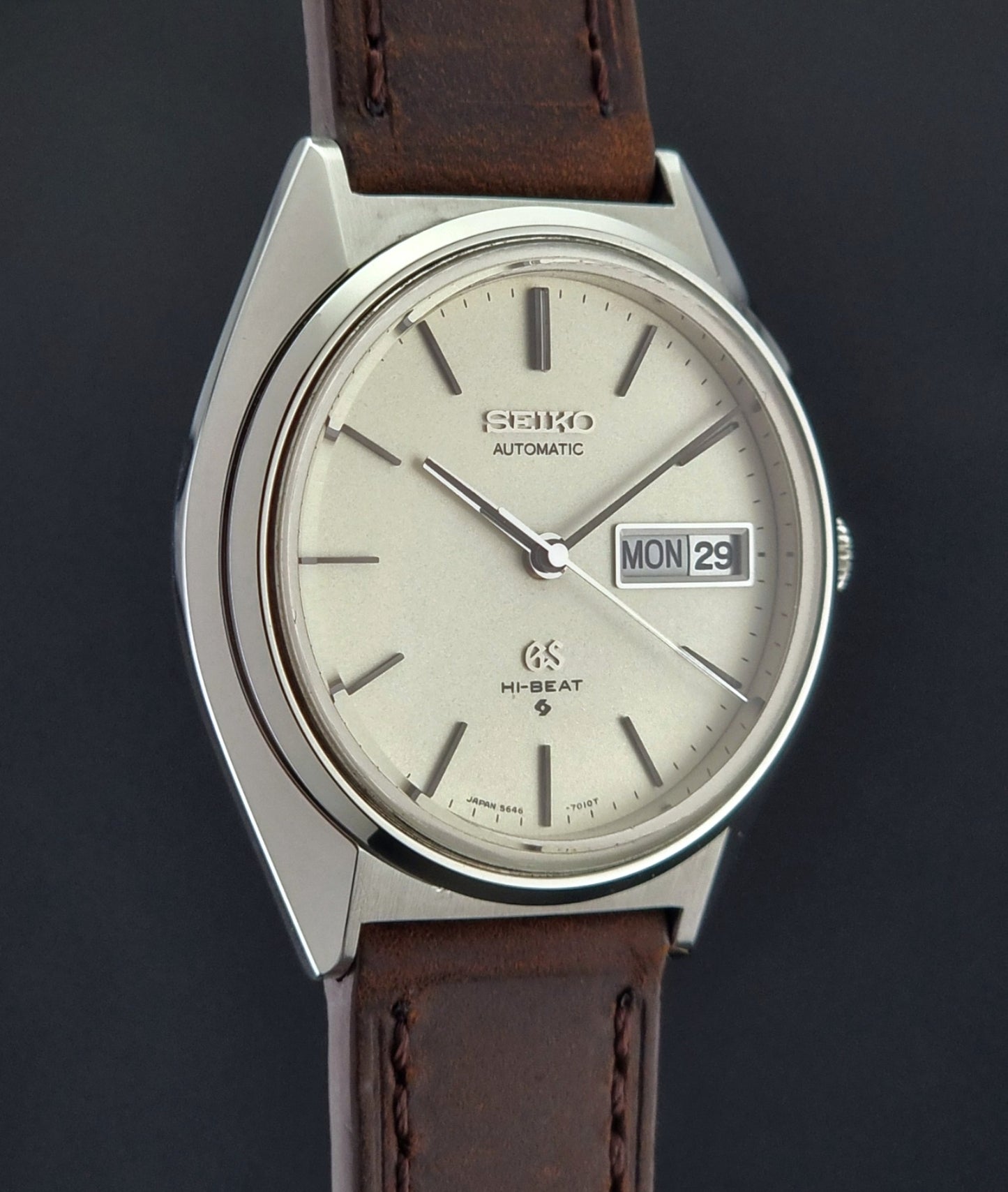 Vintage Grand Seiko Watch with brown leather strap on a dark background
