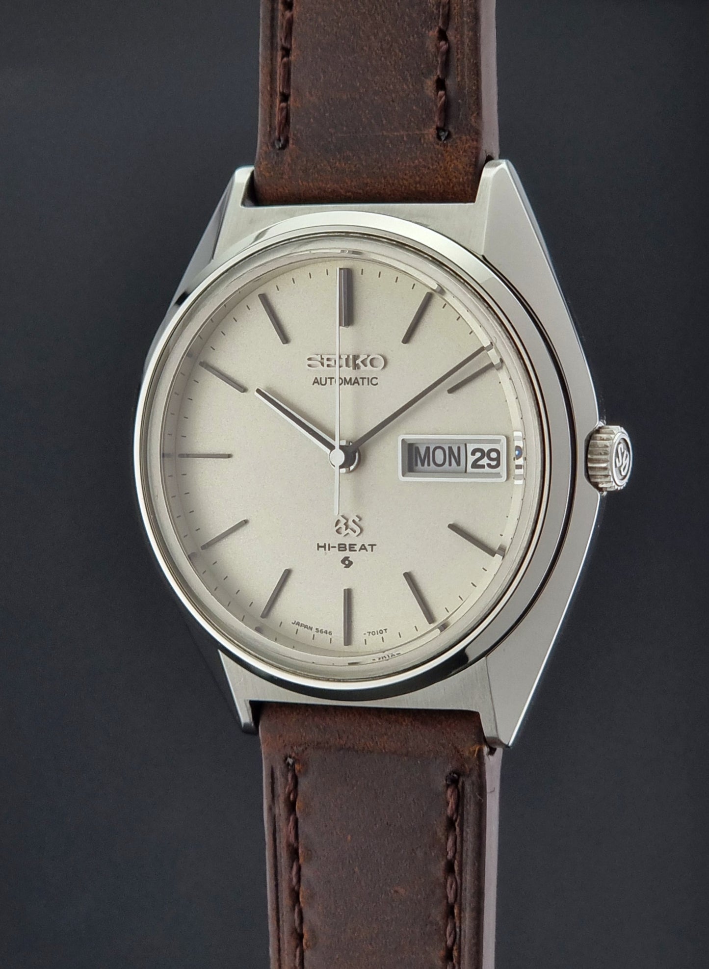 Vintage Grand Seiko Watch with brown leather strap on a dark background