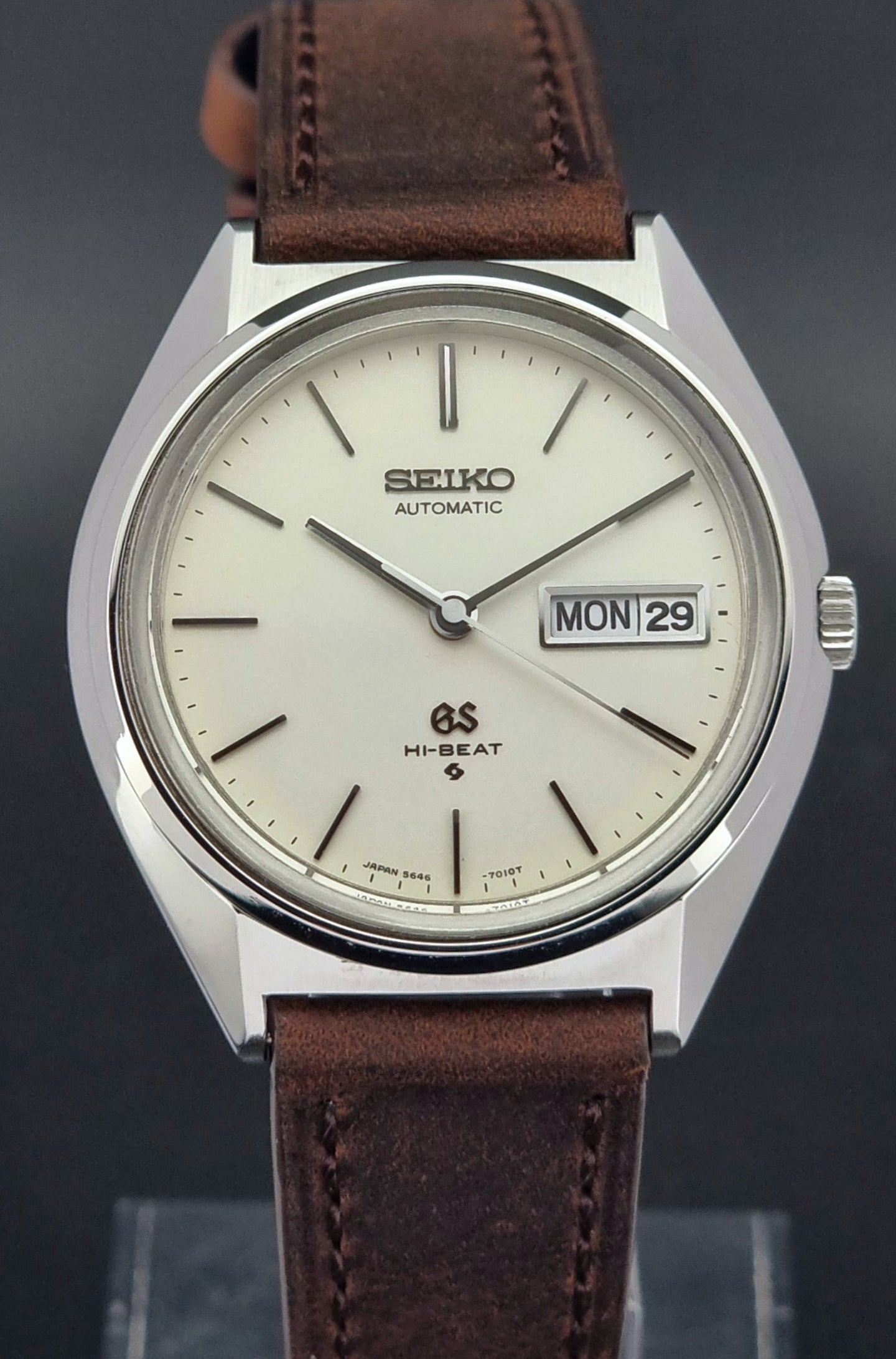 Vintage Grand Seiko Watch with brown leather strap on a dark background