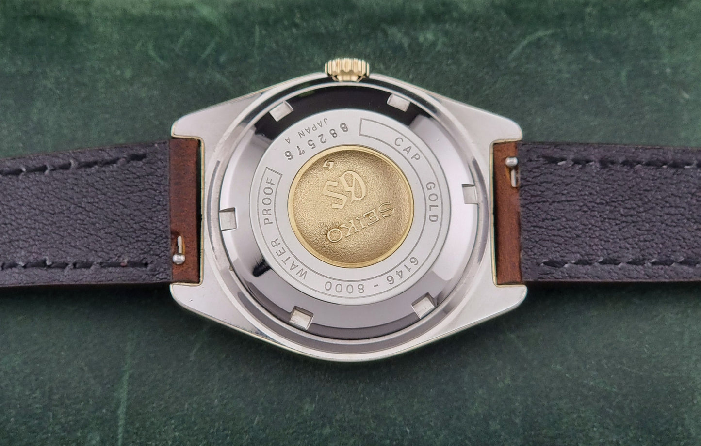 Vintage Grand Seiko watch 6146-8000 in gold with a brown leather strap case back