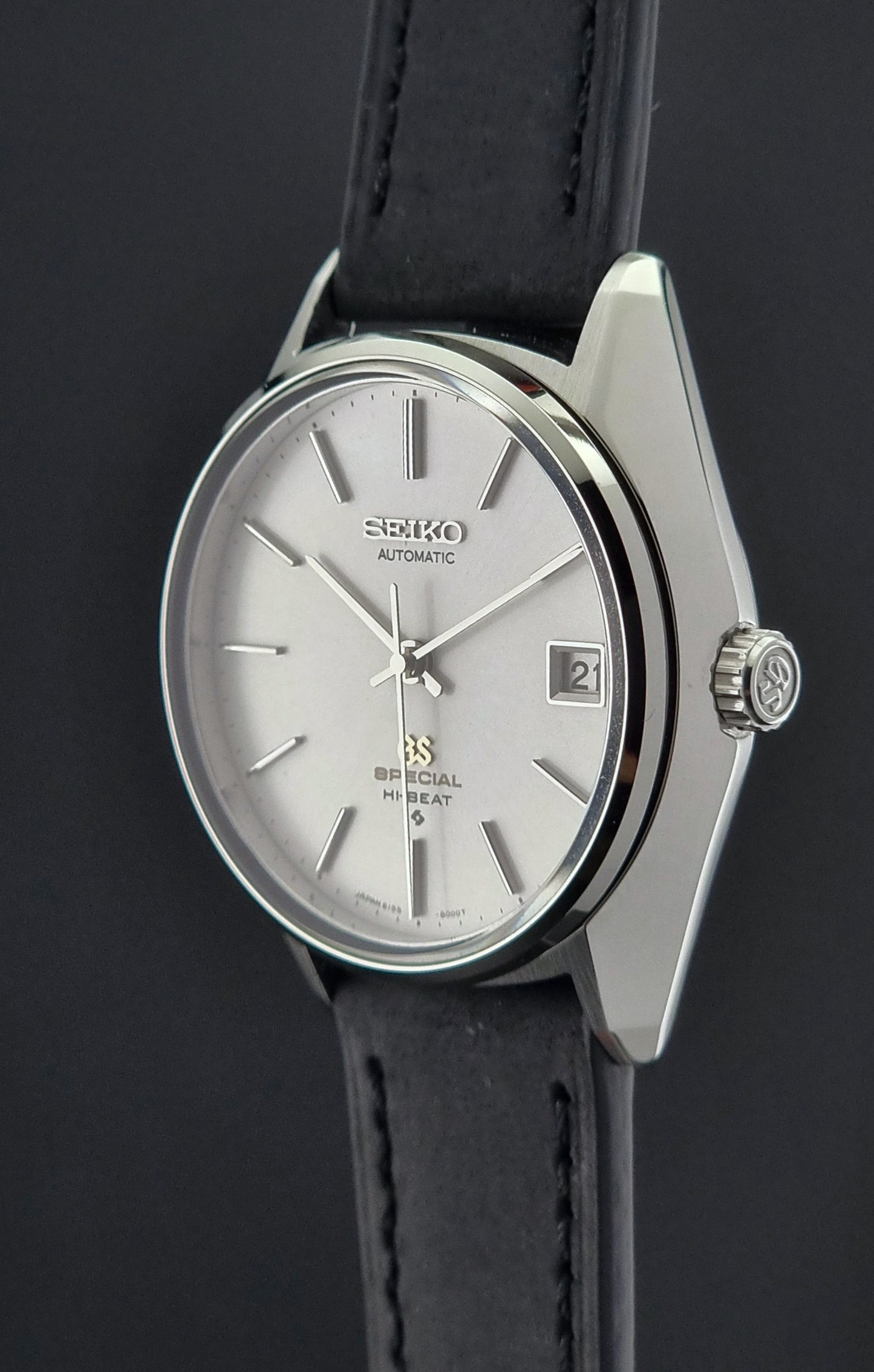 Vintage Grand Seiko Wristwatch with black strap on a dark background