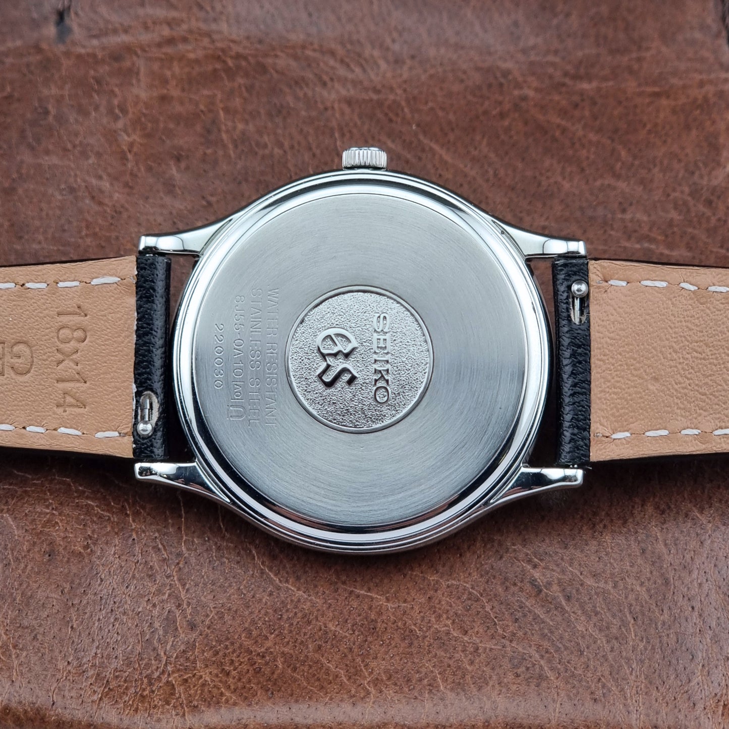 Back view of a Grand Seiko SBGF015 Wristwatch 8J55-0A10 quartz on a black leather strap