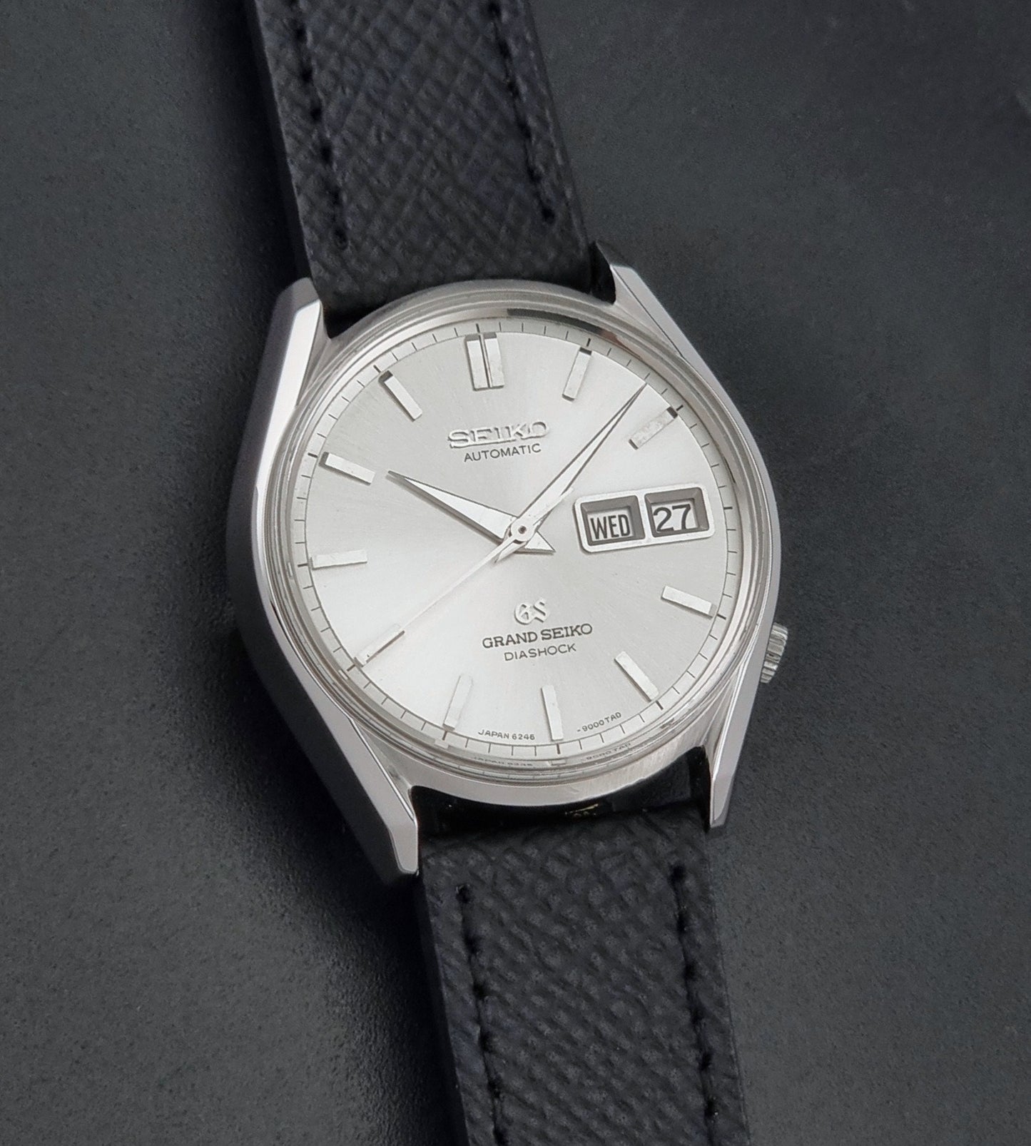 Vintage Grand Seiko 6246-9001 Wristwatch on a dark background front view