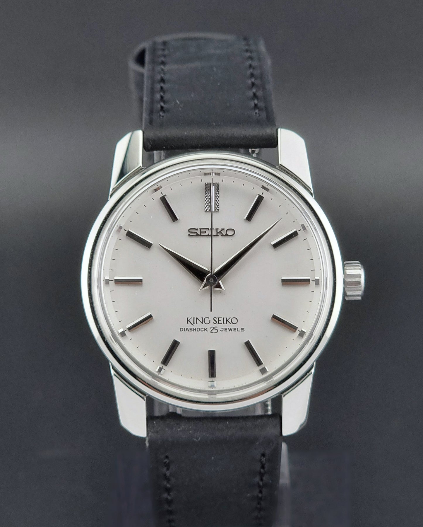 Vintage King Seiko 44-999 Watch with black leather strap on a dark background