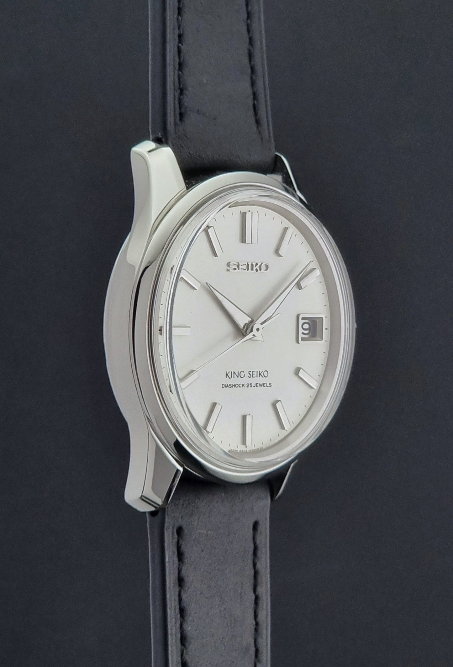 Vintage King Seiko 4402-8000 watch with black leather strap on a dark background