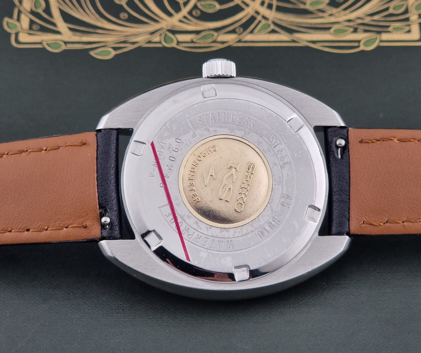 Vintage King Seiko Wristwatch 45-8010 close up of the case back with gold medallion and KS logo