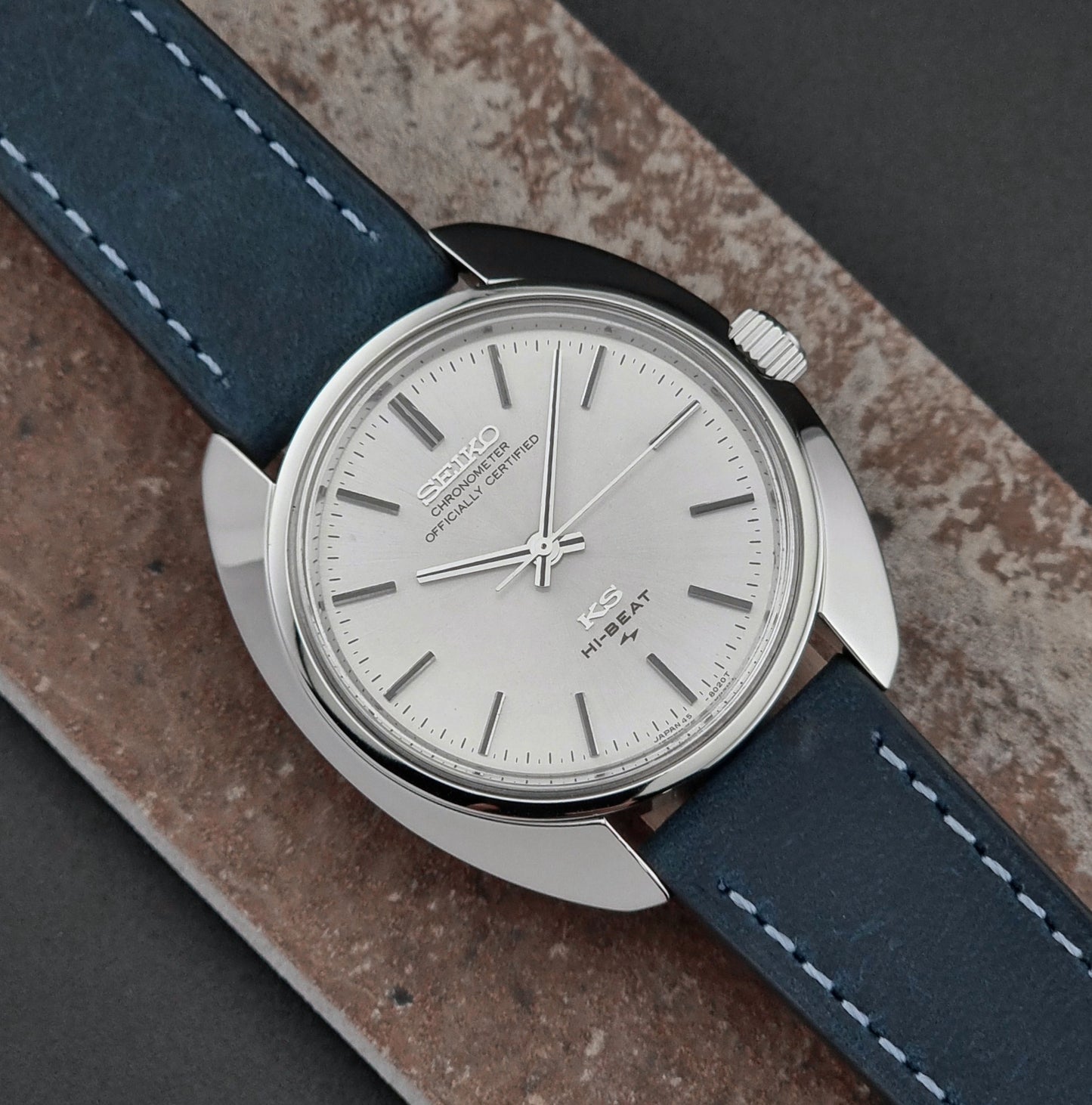 Vintage King Seiko Watch with blue leather strap on a textured surface