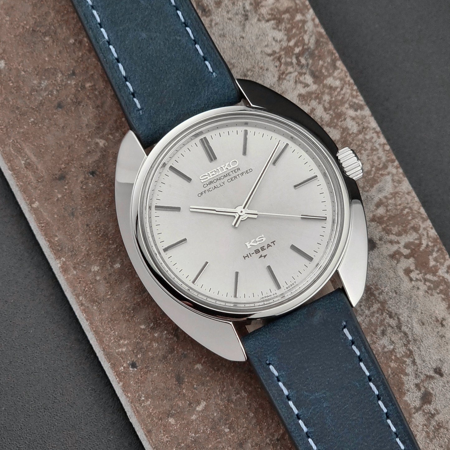 Vintage King Seiko Watch with blue leather strap on a textured surface