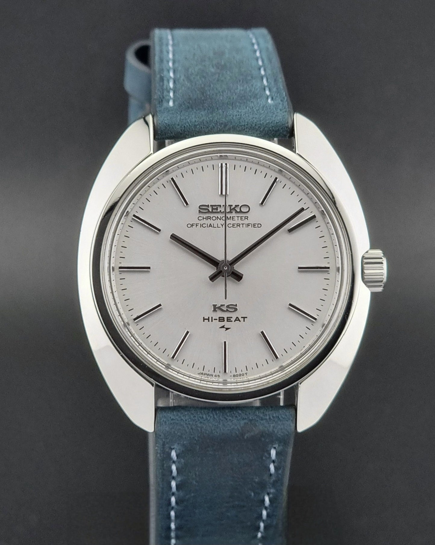 Vintage King Seiko watch with blue strap on a dark background