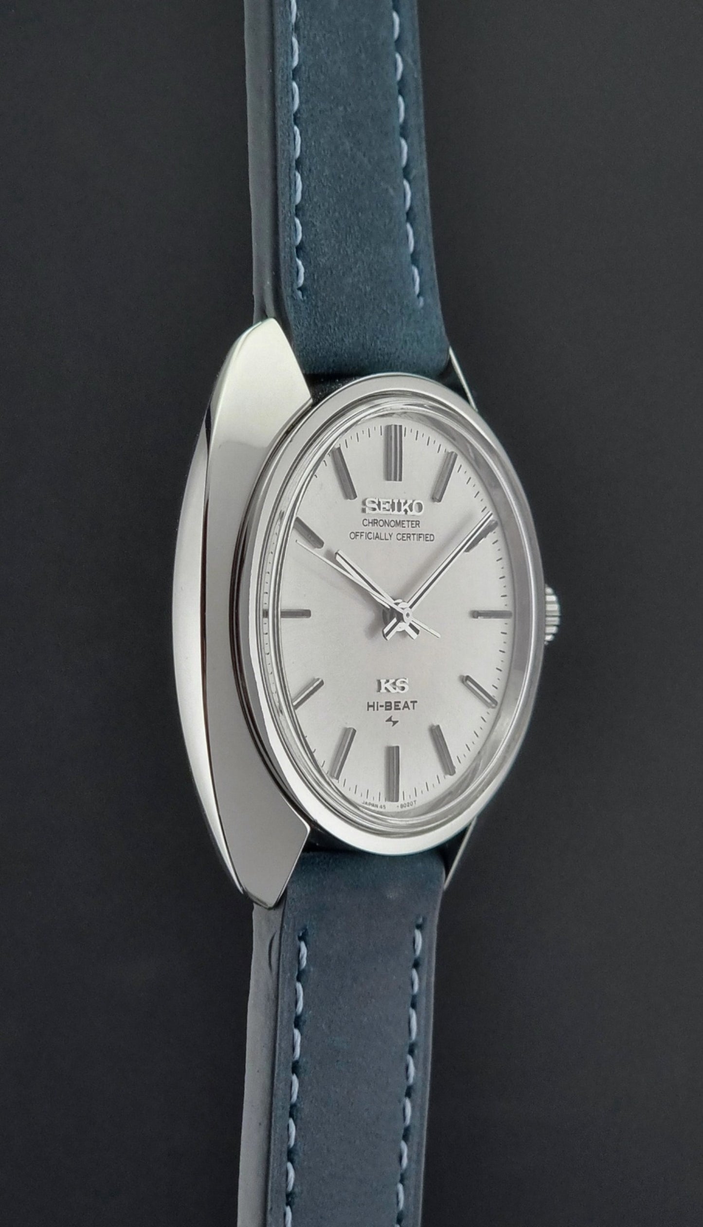 Vintage King Seiko Watch with silver case and blue leather strap on a dark background