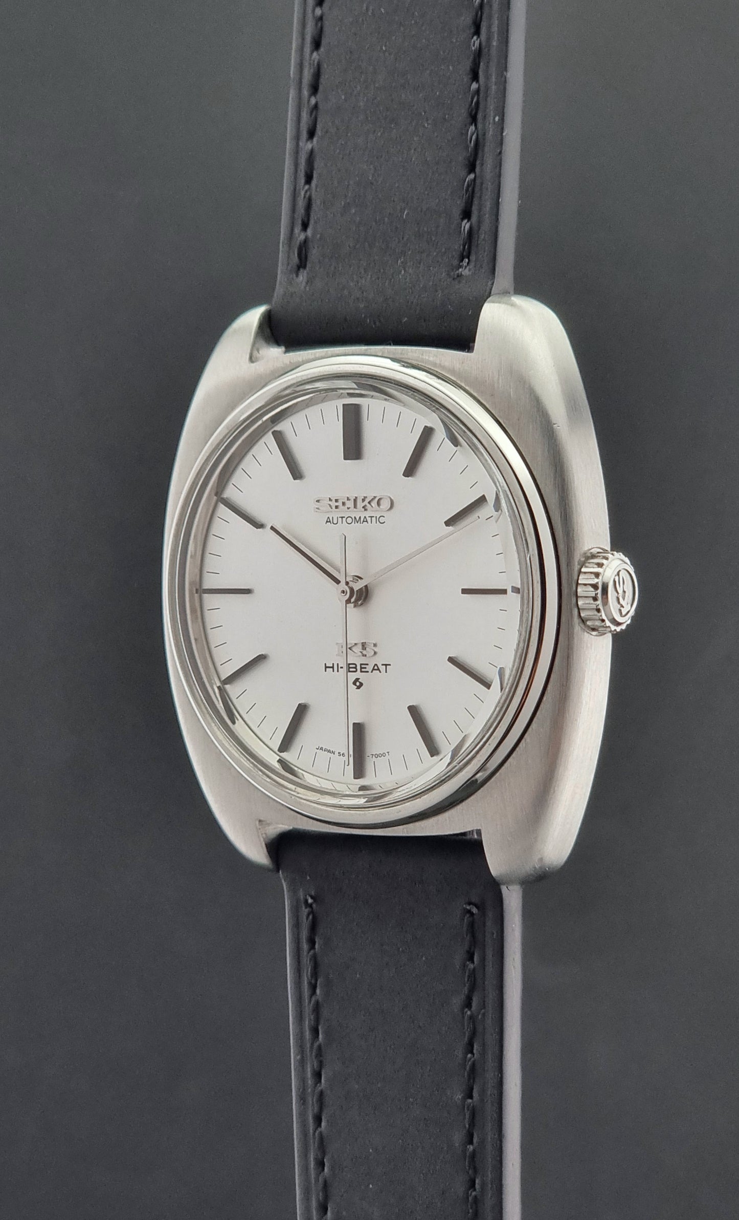 Vintage King Seiko 5621-700 Wristwatch with black leather strap on a dark surface crown profile
