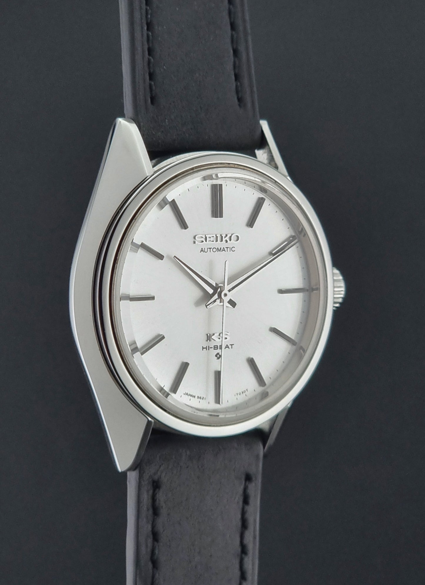 King Seiko watch with black leather strap on a dark background