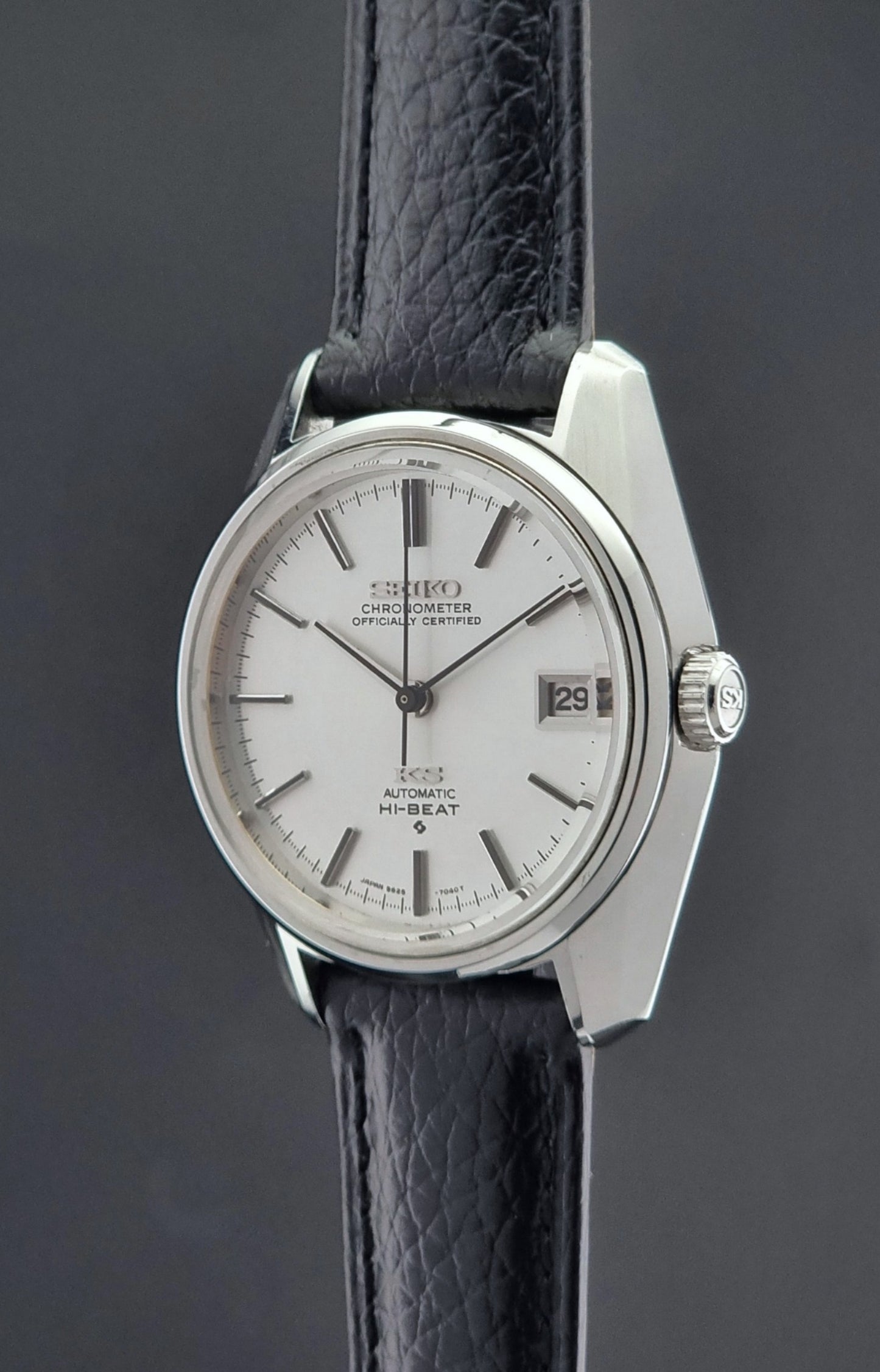 Vintage King Seiko 5625-7041 Wristwatch with black leather strap on a dark surface crown profile