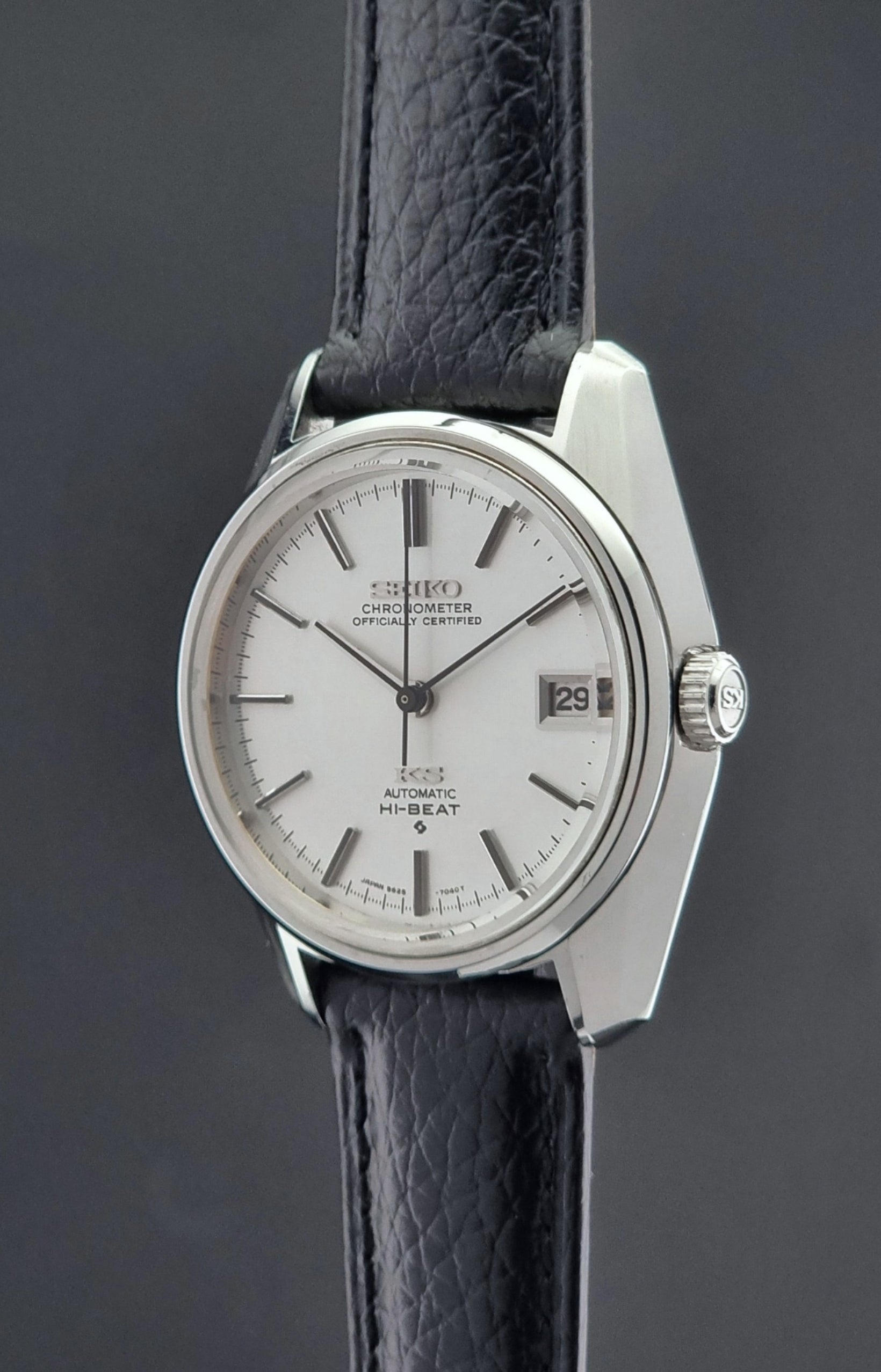 Vintage King Seiko 5625-7041 Wristwatch with black leather strap on a dark surface crown profile
