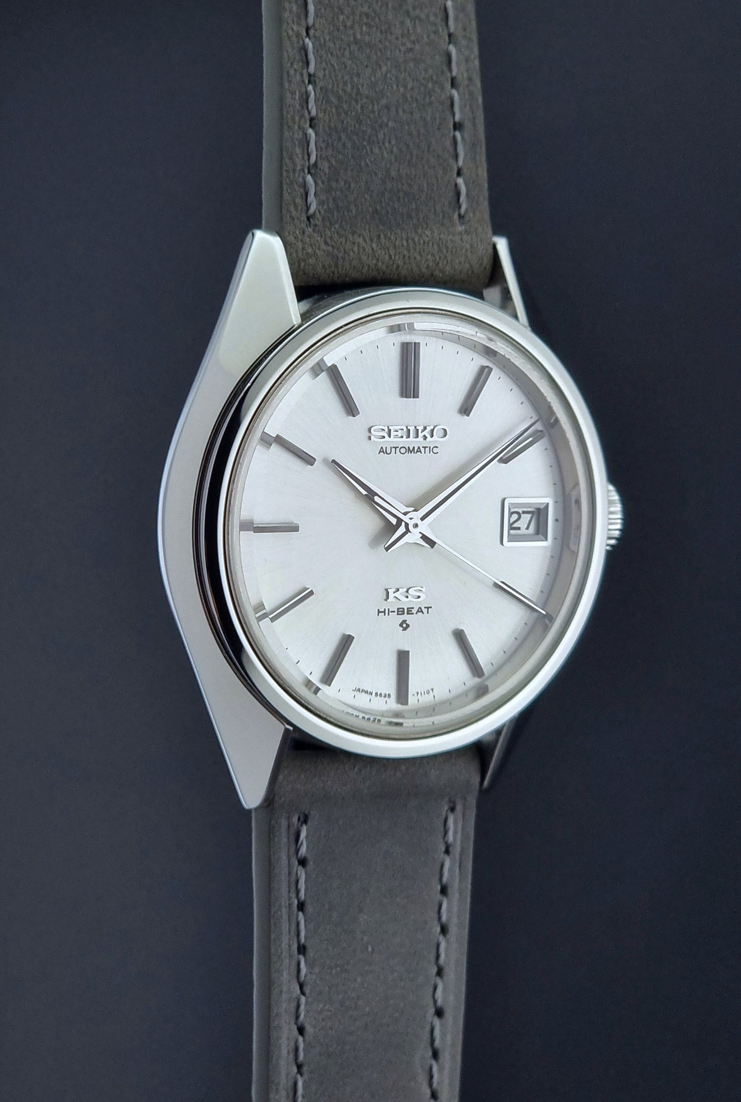 Vintage King Seiko watch with gray strap on a dark background
