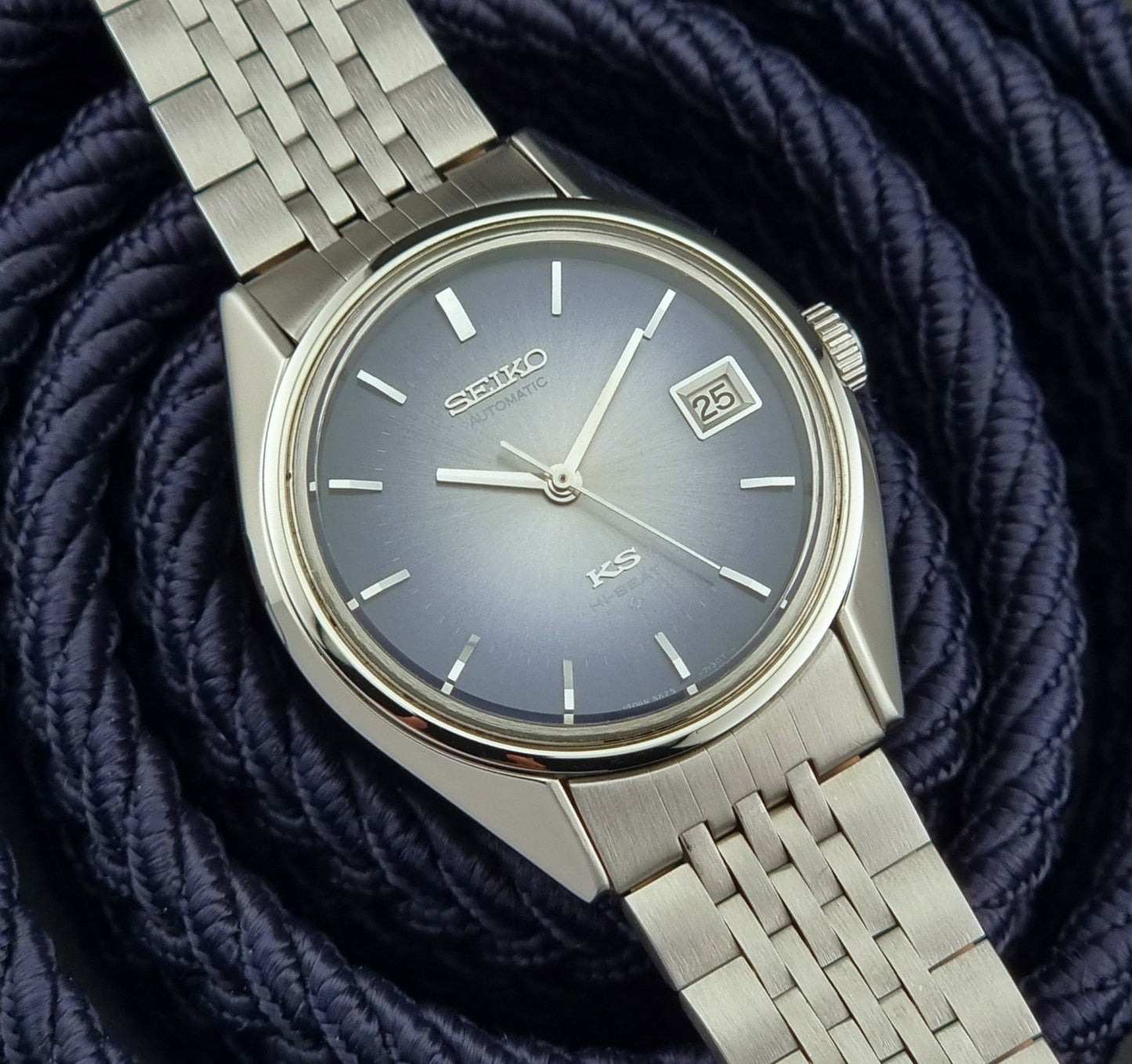 King Seiko watch with a blue dial on a textured blue background