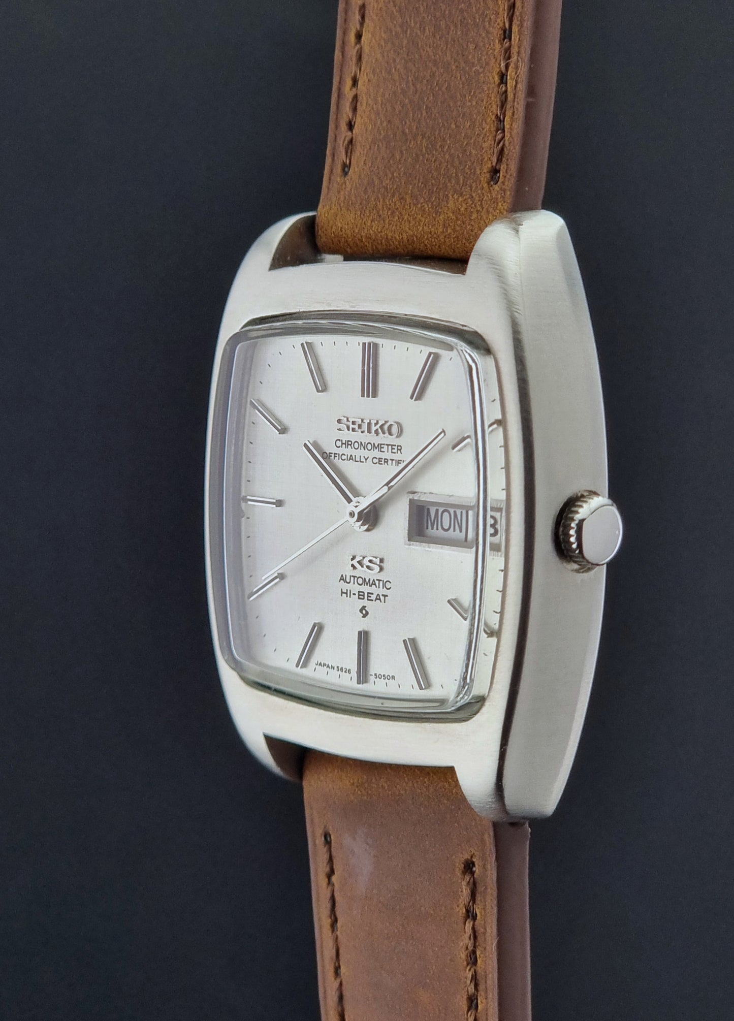 Vintage King Seiko 5626-5040 watch with brown leather strap on a textured gray background
