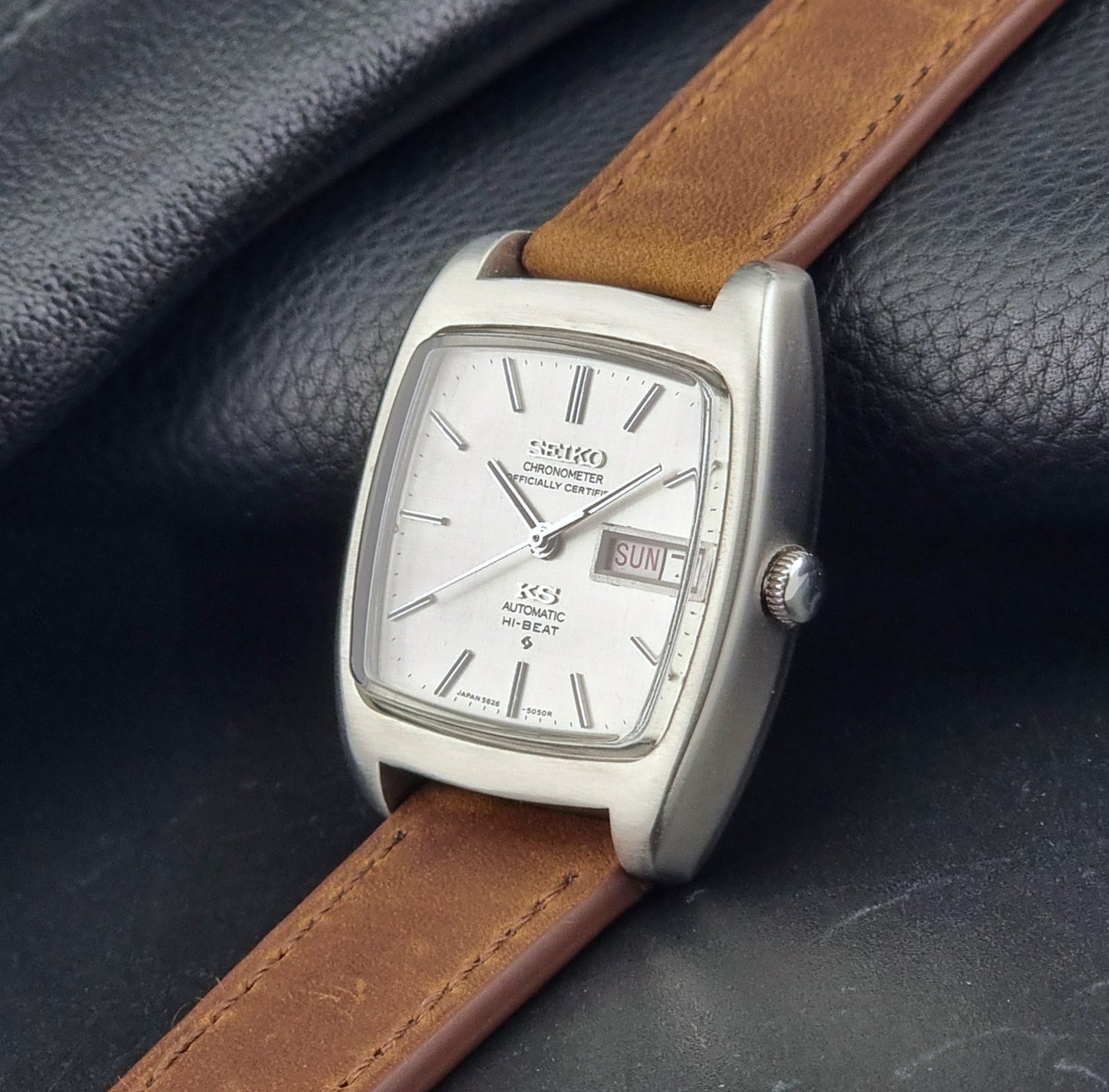Vintage King Seiko 5626-5040 watch with brown leather strap on a textured gray background
