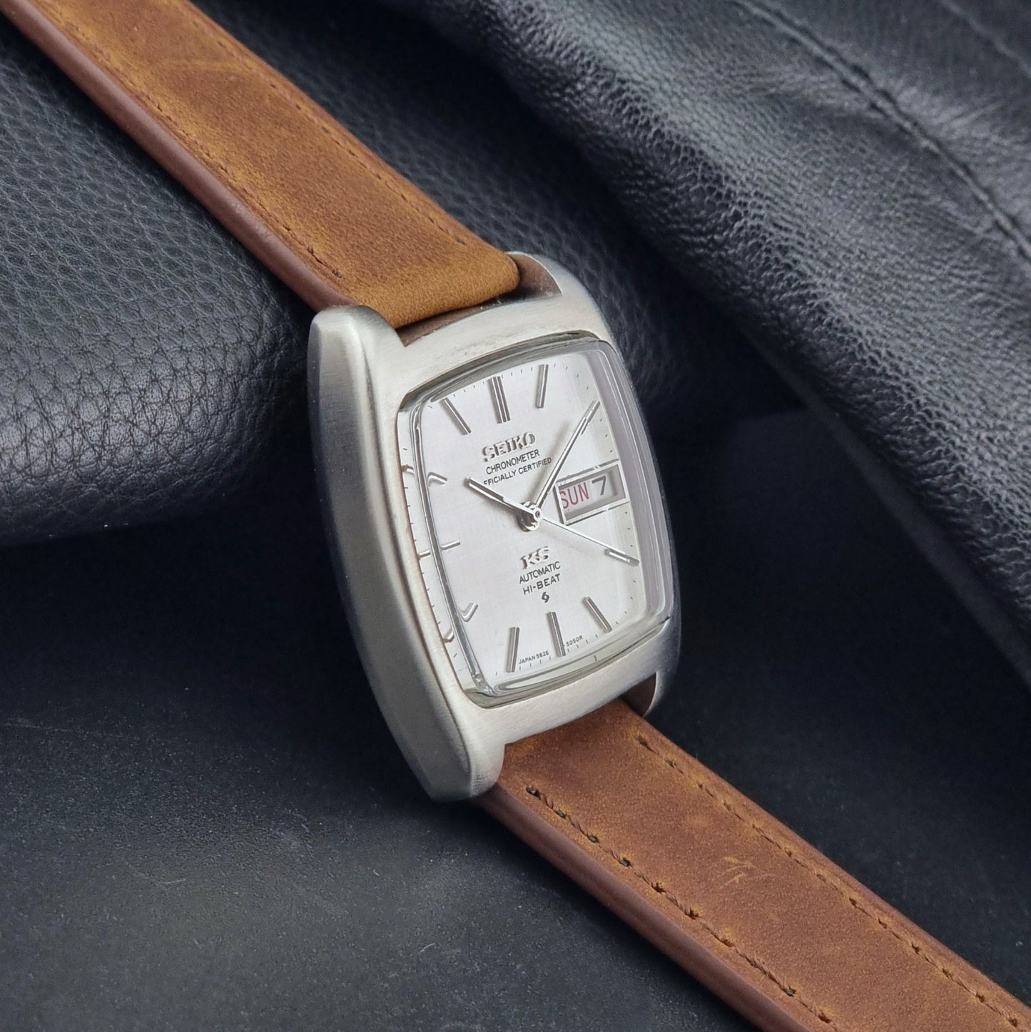 Vintage King Seiko 5626-5040 watch with brown leather strap on a textured gray background