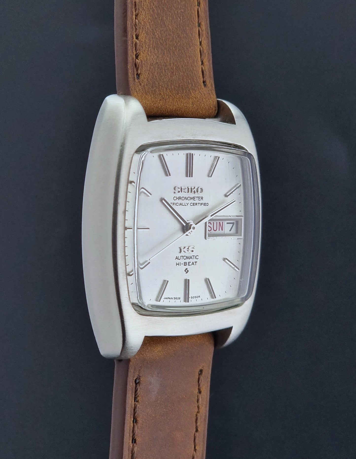 Vintage King Seiko 5626-5040 watch with brown leather strap on a textured gray background