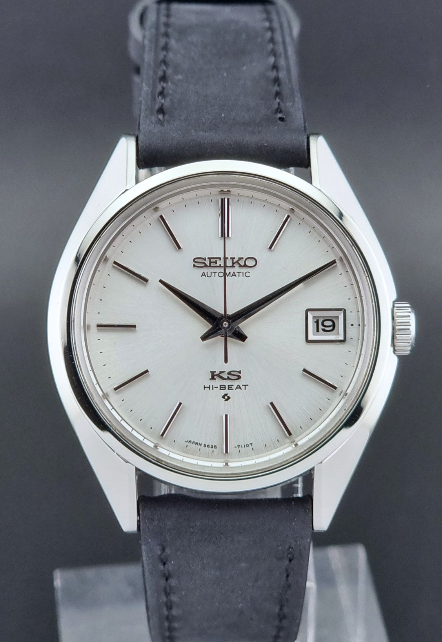 Vintage King Seiko watch with a white dial on a dark background