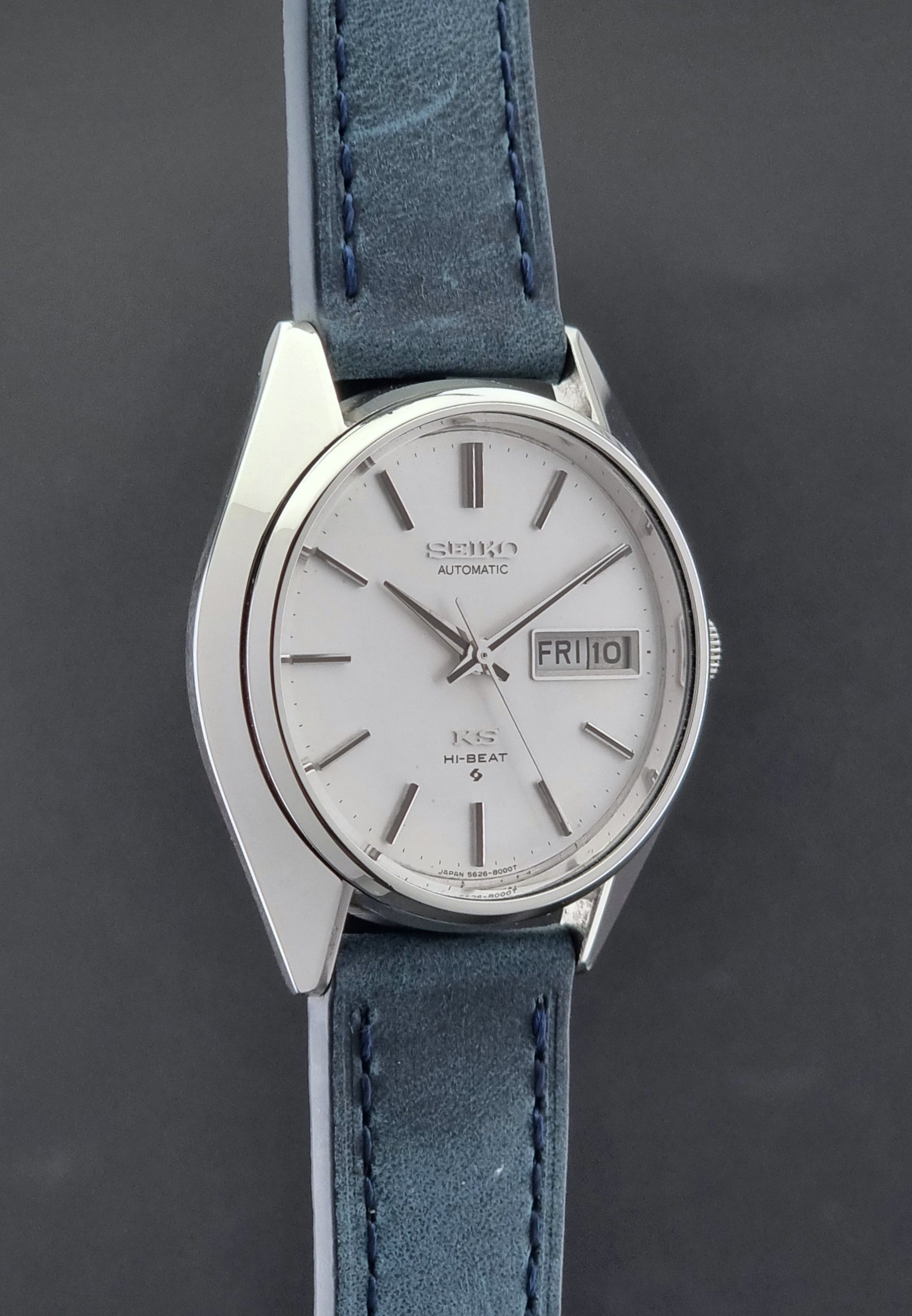 Vintage King Seiko Wristwatch 5626-8000 with a blue leather strap on a grey background side profile