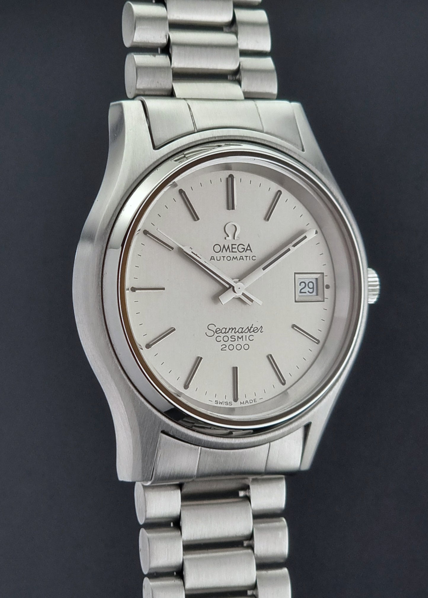 Vintage Omega Seamaster watch with a dark background