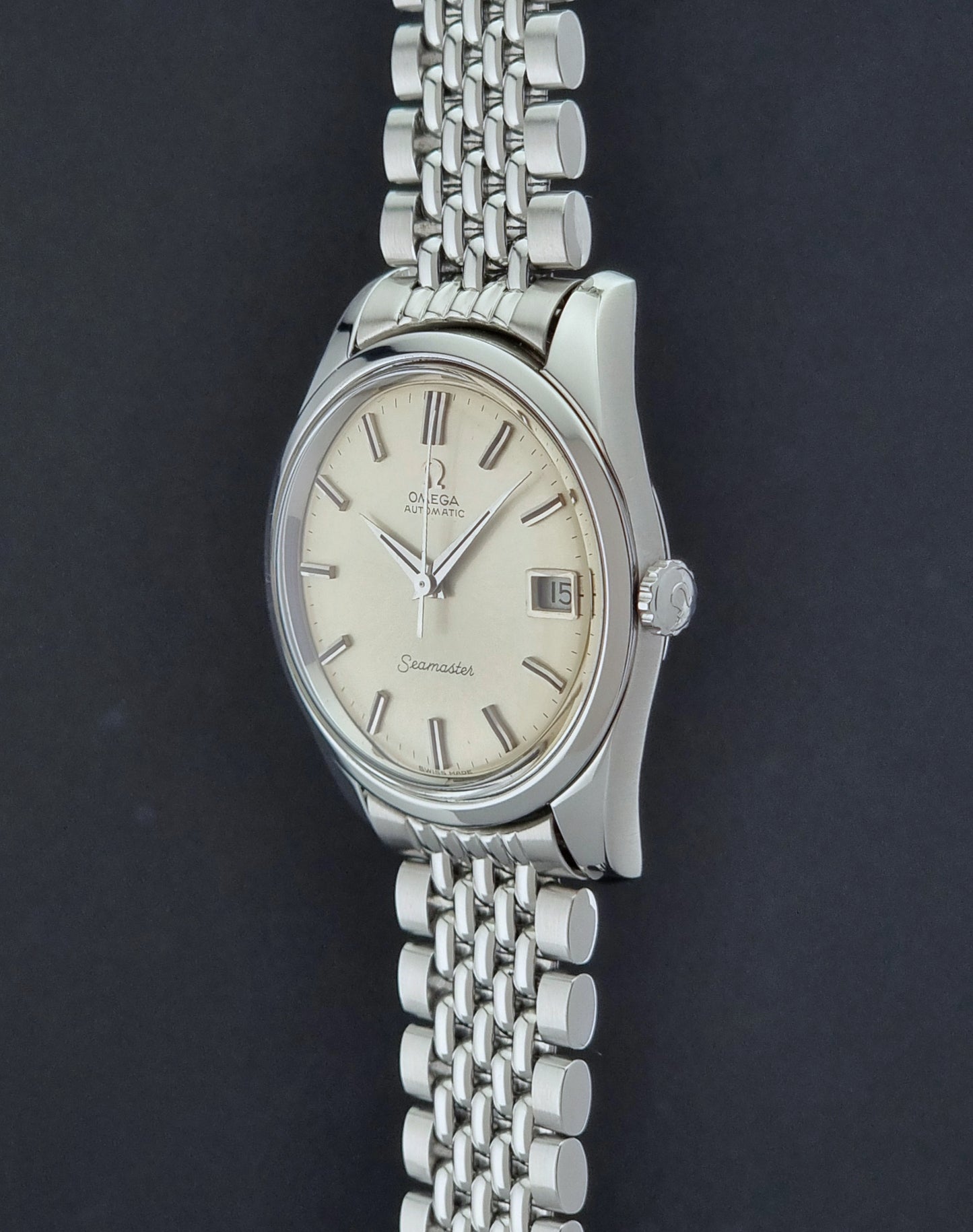 Vintage Omega Wristwatch Seamaster 166.010 with a detailed face on a dark background side profile view