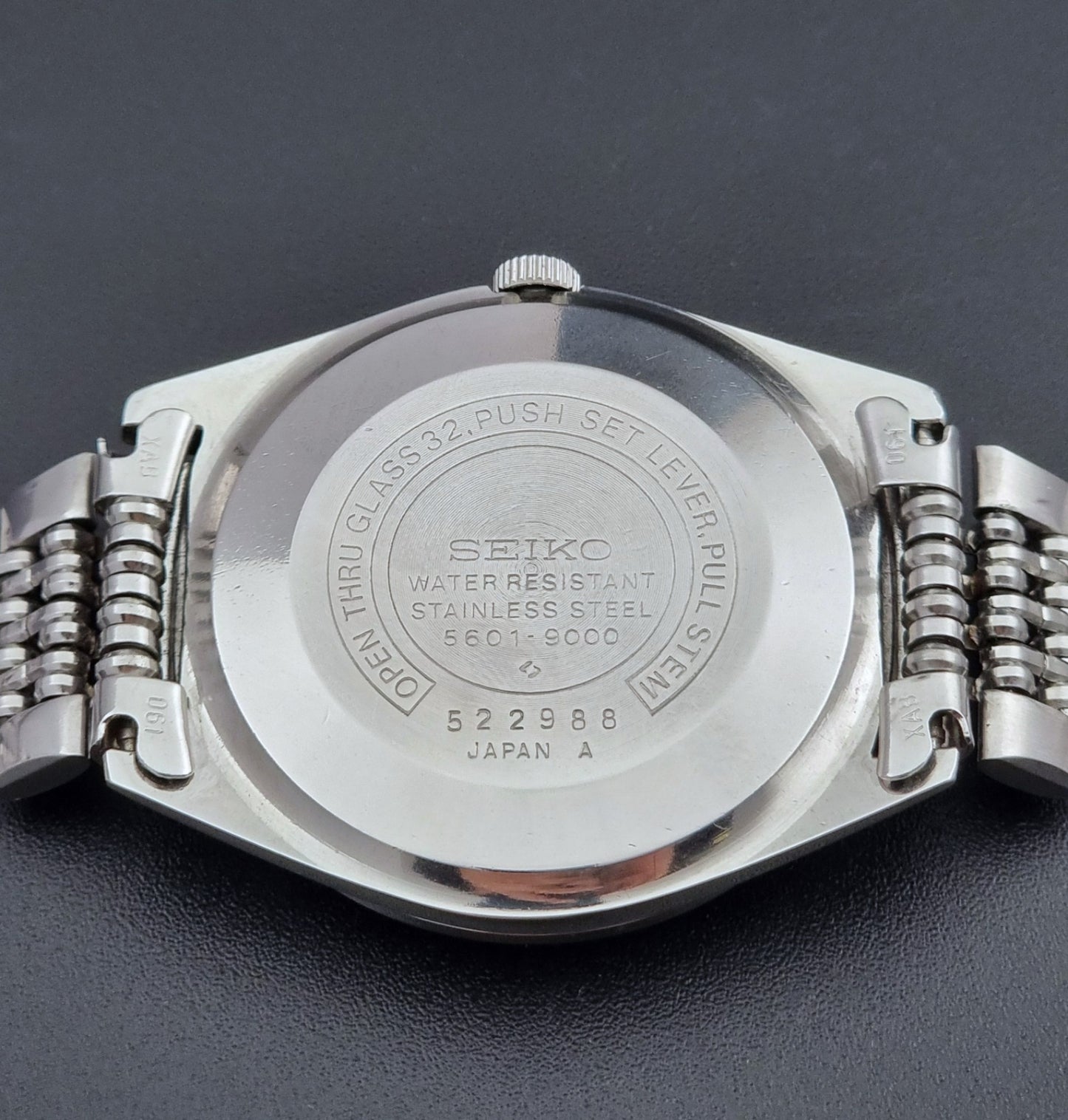 Vintage Seiko watch LordMatic 5601-9000 on a dark background case back