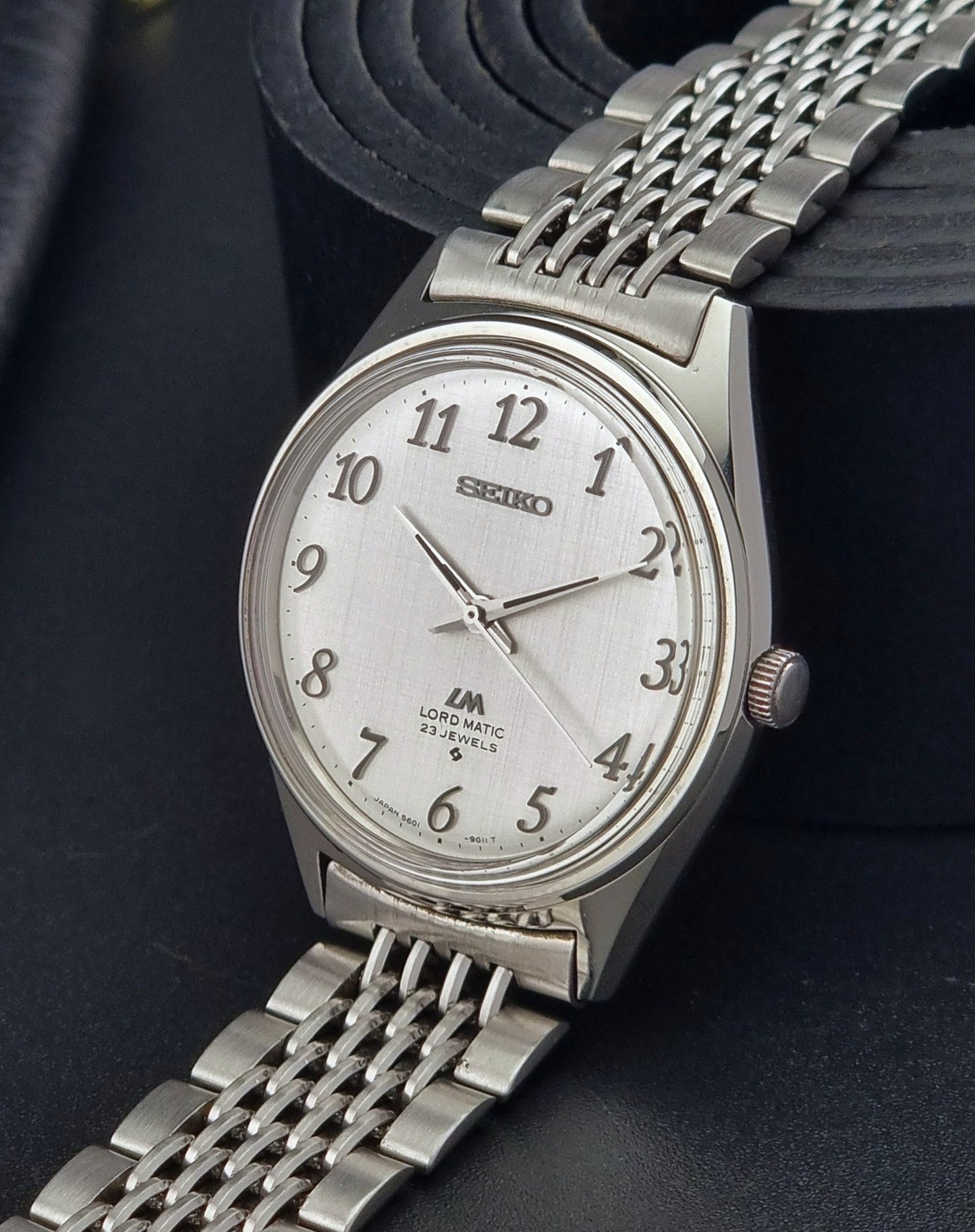 Seiko Lord Matic watch with a white face on a dark background