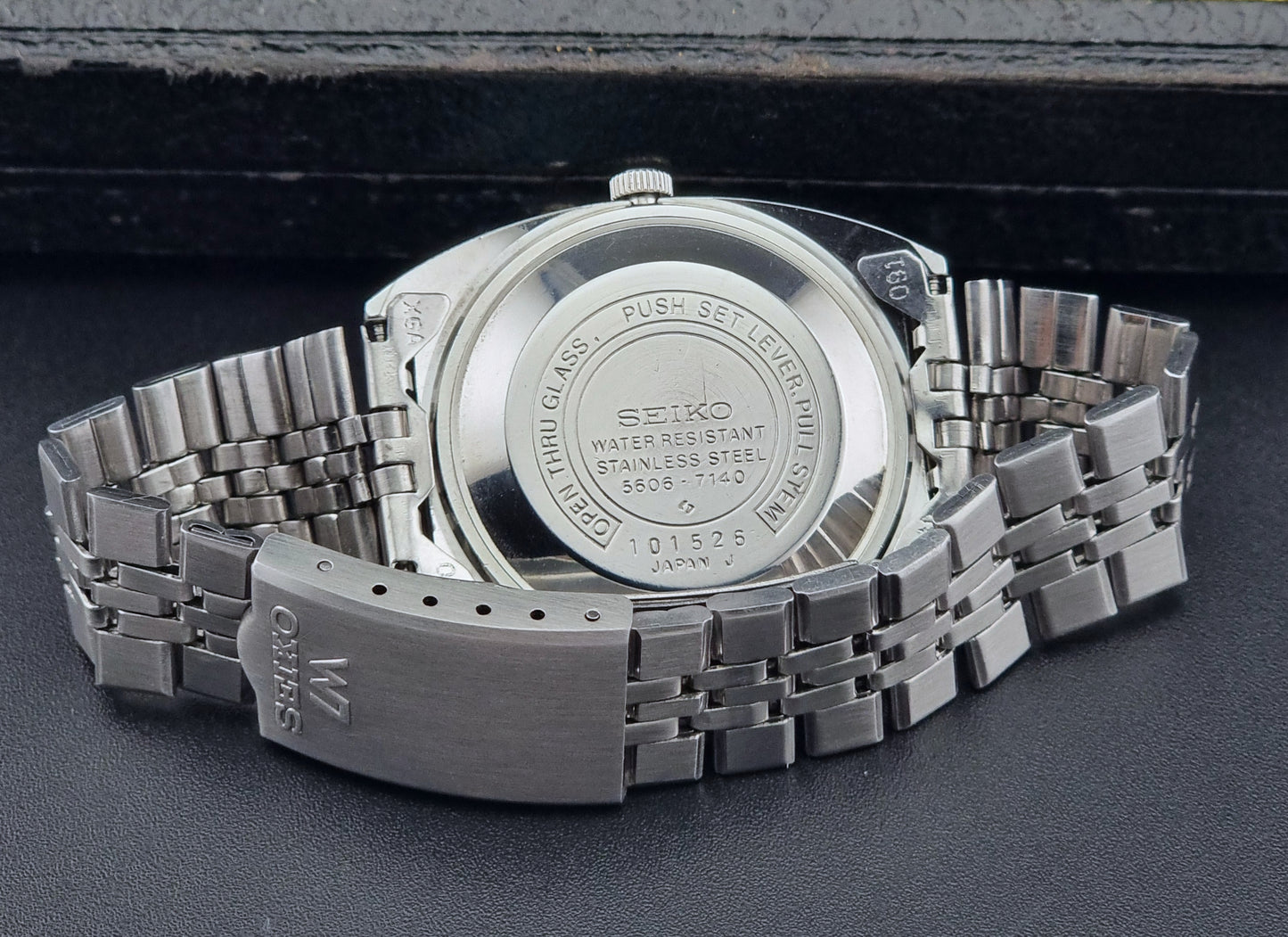 Vintage Seiko Lordmatic 5606-7140 watch on a dark background