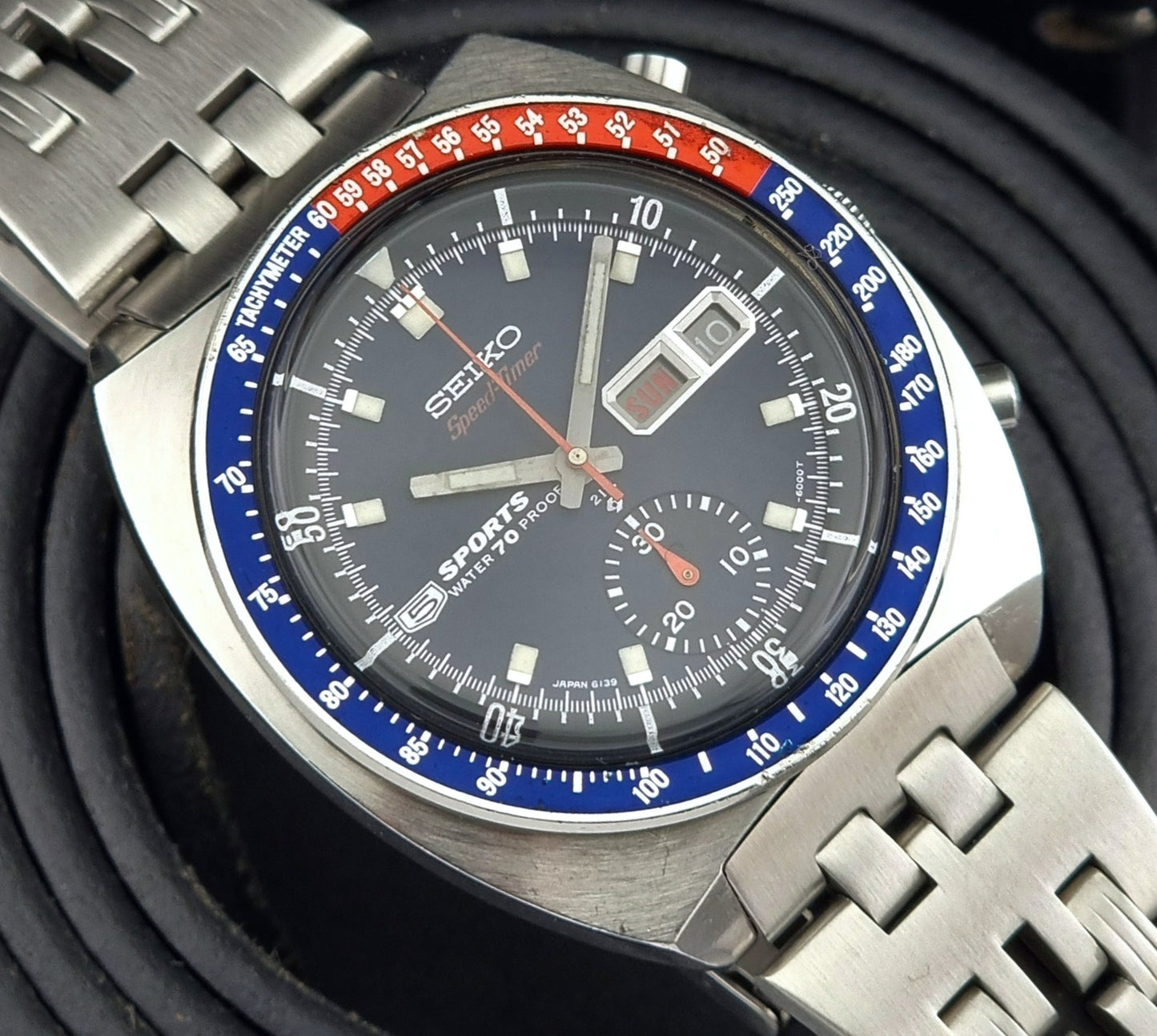 Close-up of a Seiko watch with a detailed face and metal band.