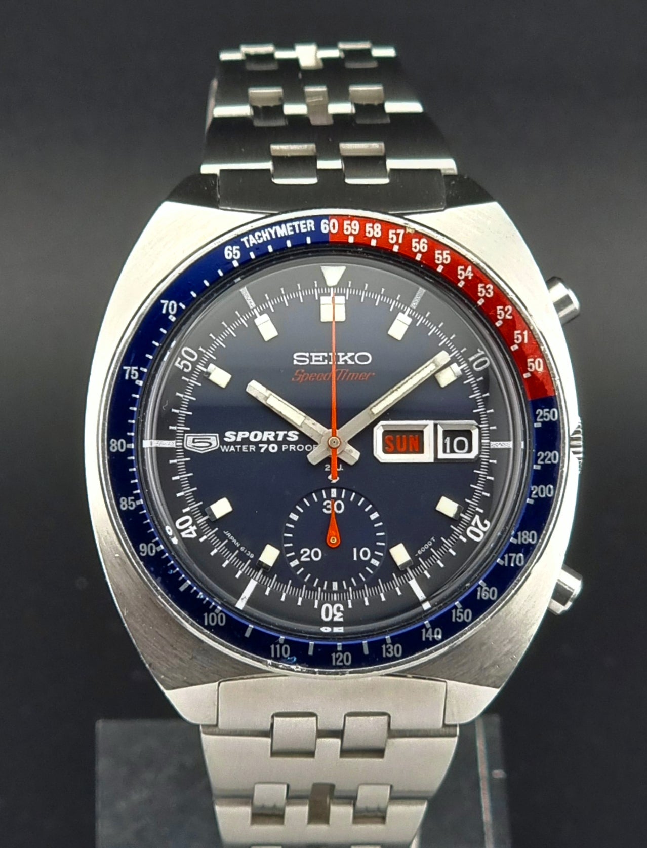 Seiko watch with a silver bracelet on a black background