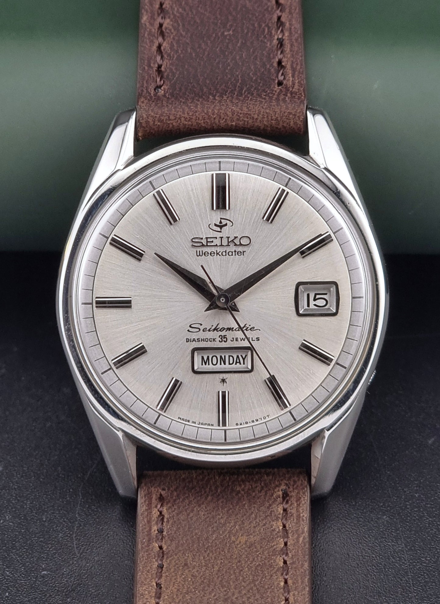 Vintage Seiko watch with brown leather strap on a dark background