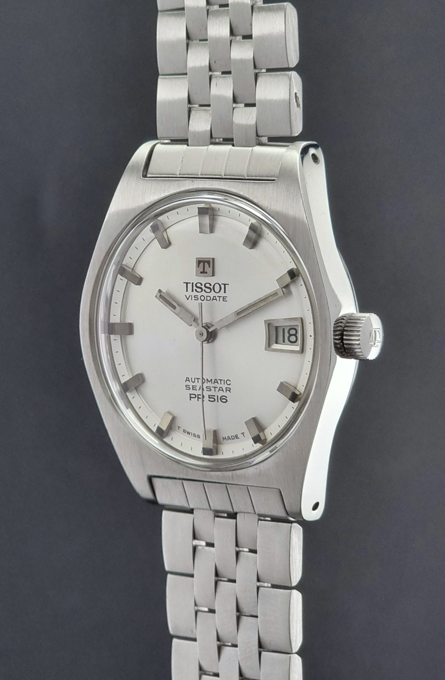 Tissot Seastar Visodate watch with a dark background