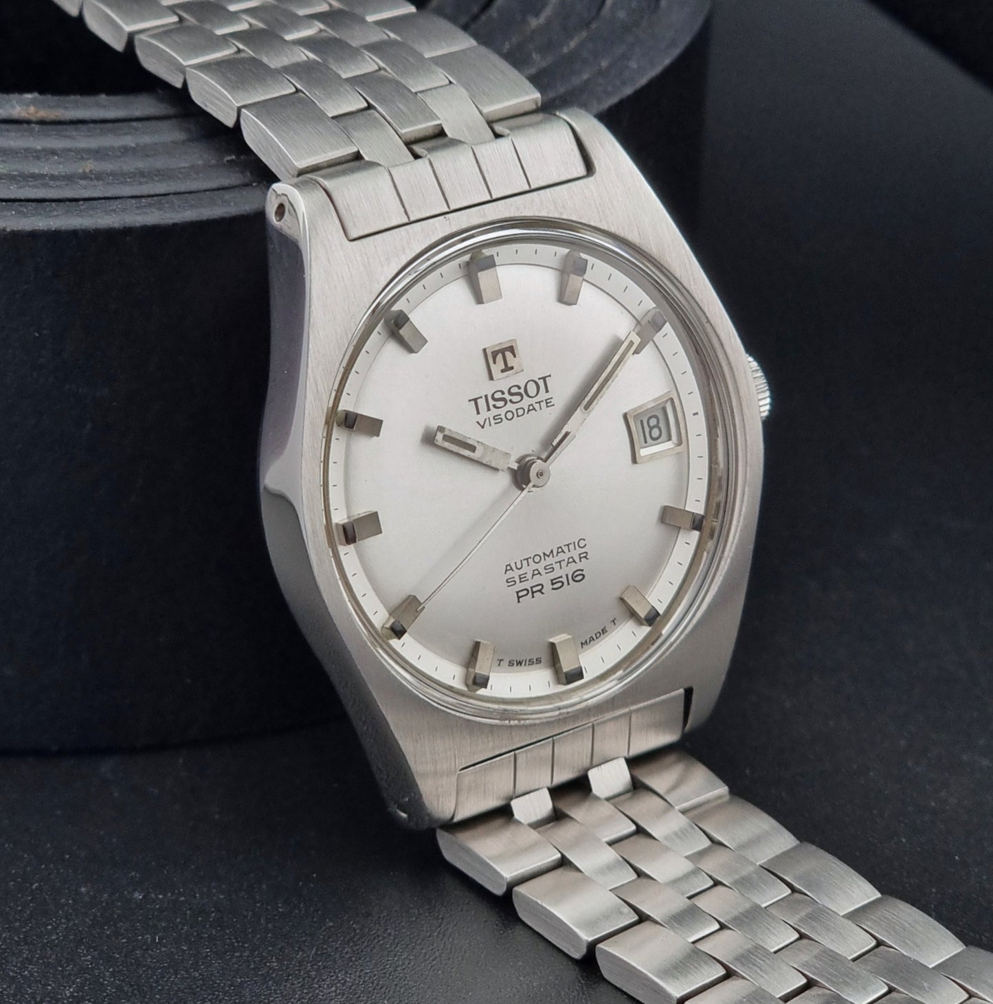 Tissot Seastar Visodate watch with a detailed face on a dark background