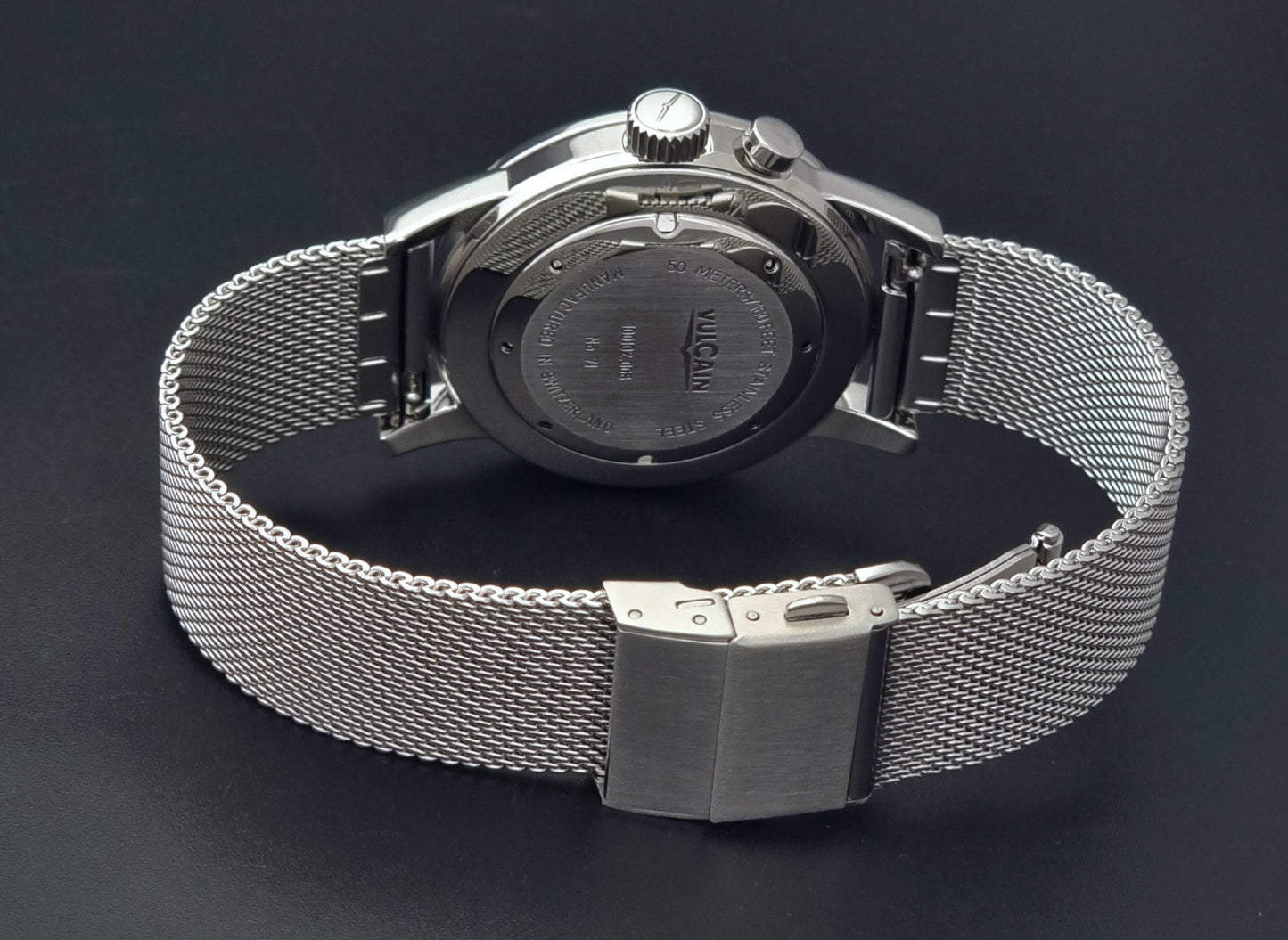 Vulcain Cricket Alarm watch 100102.008 with a blue face on a dark gray background clasp view