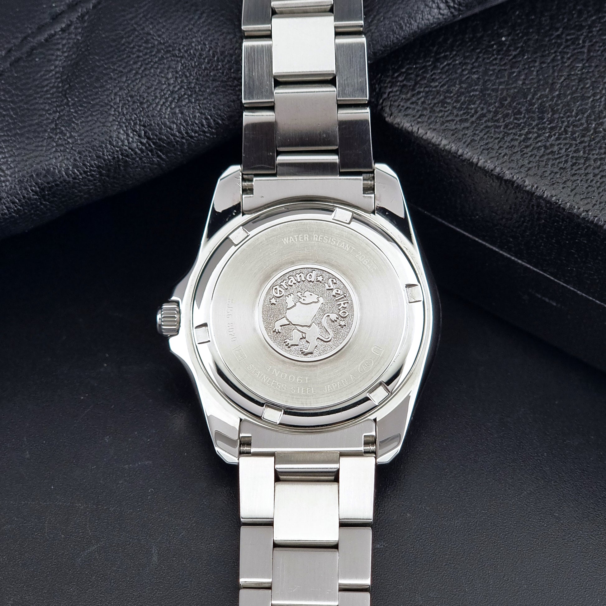 Grand Seiko SBGF021 quartz watch 8J56-8020 case back showing the Grand Seiko logo