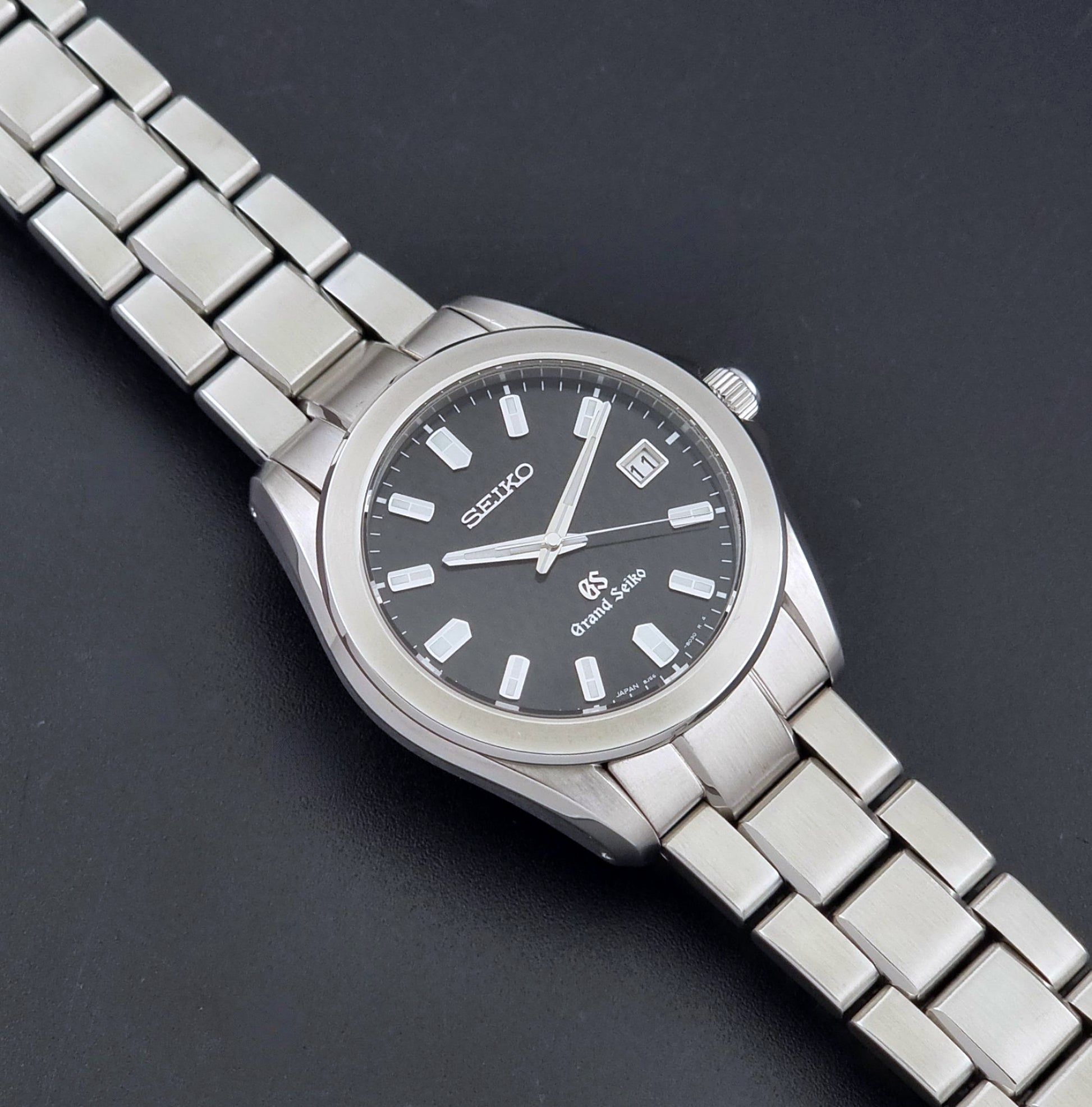 Grand Seiko SBGF021 quartz watch 8J56-8020 angled view on a dark backgound
